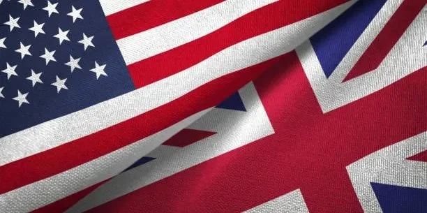 Close-up of overlapping American and British flags.