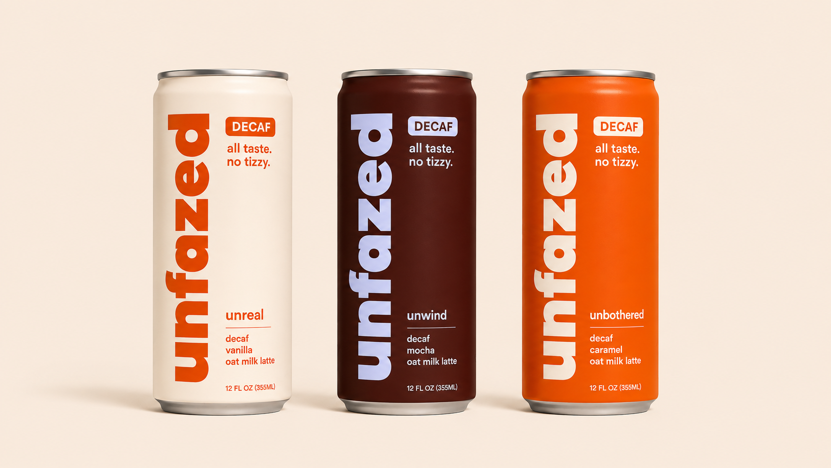 Three cans of Unfazed decaf oat milk latte beverage in different flavors, standing side by side against a plain background.