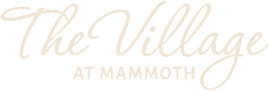 Graphic logo with the text 'The Village at Mammoth' in elegant white script on a black background.