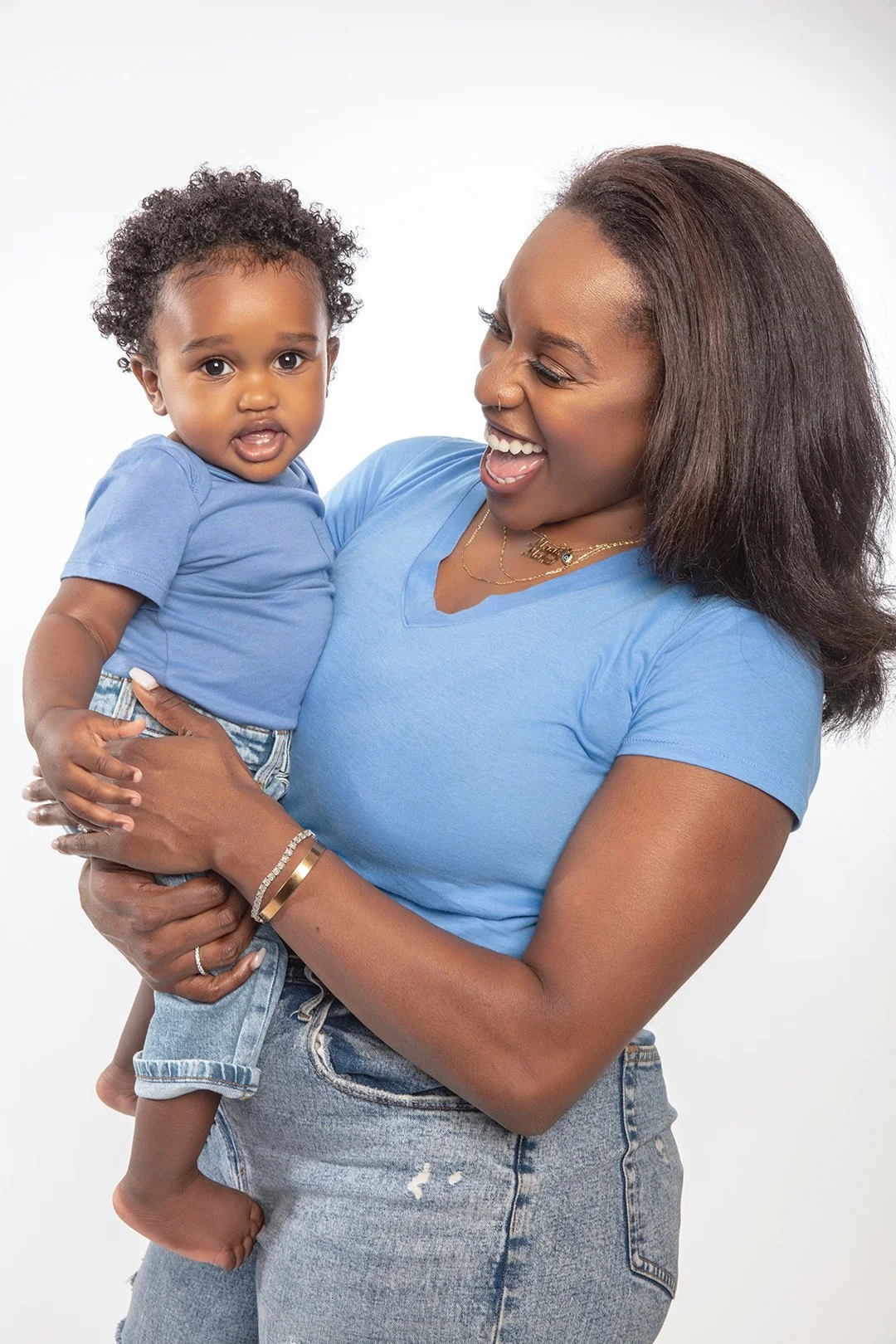 Photo of Black mother holding baby