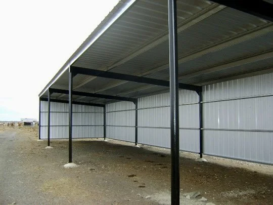 Three-side Hay and Implement shed with Pipe columns, wide flange beam trusses. Galvanized purlin, PBR Panel roof and wall sheets.