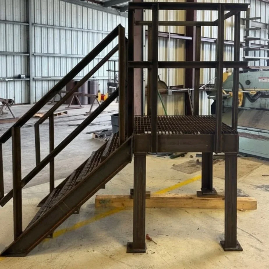 Custom fabricated industrial platform with stair system. Designed and welded in-house by Victoria Metal Supply.