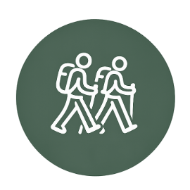 Icon of two hikers walking with backpacks on a green background.