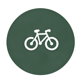 Icon of a bicycle on a green circular background.