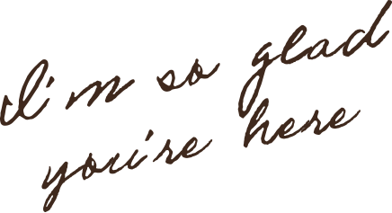 Handwritten text that says, "I'm so glad you're here."