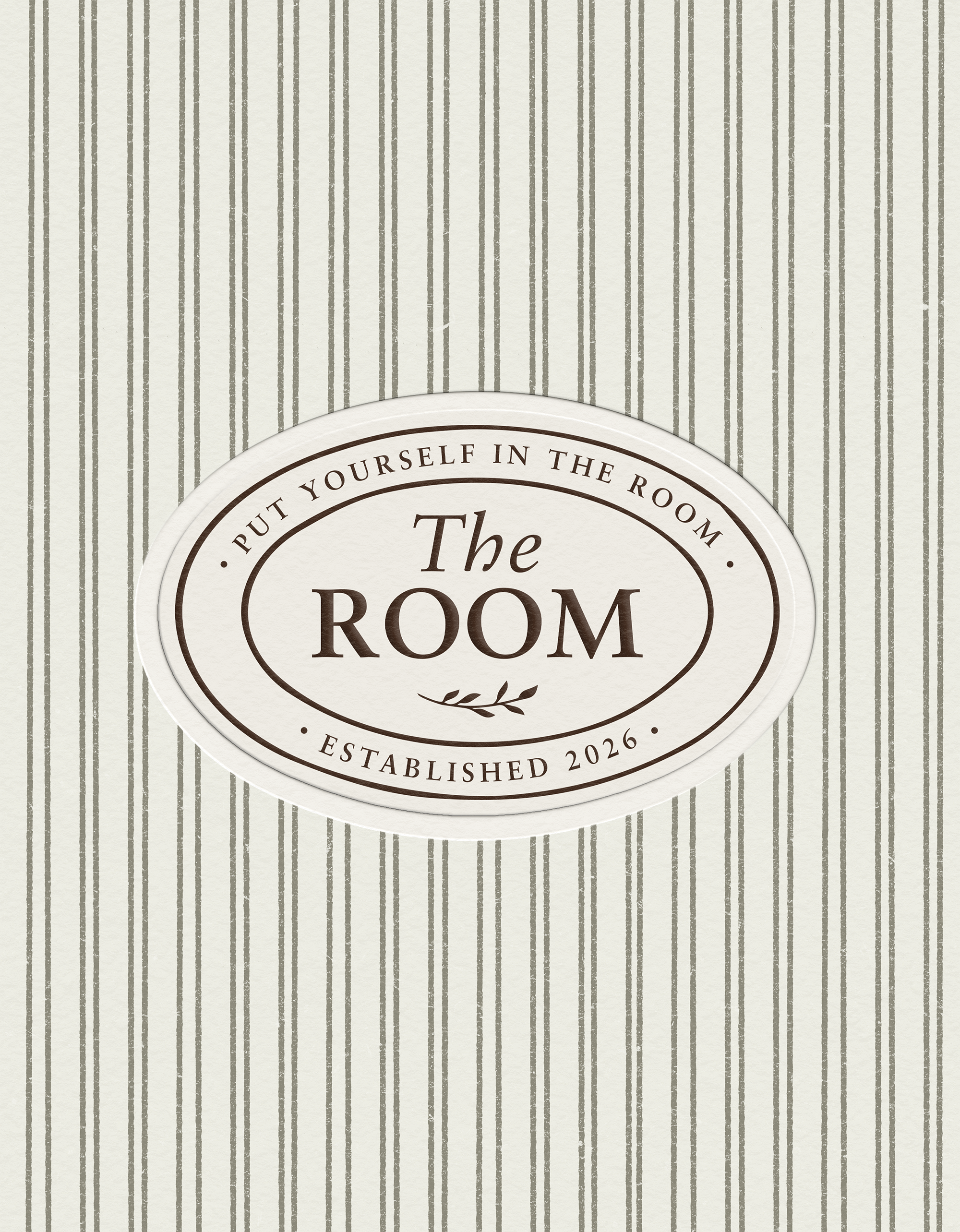 A vintage-style sign with a cream background and black text reads 'The Barn.' The sign has a border and a decorative leaf element, and it indicates the establishment was founded in 2026. The background features vertical gray stripes on a light textured surface.