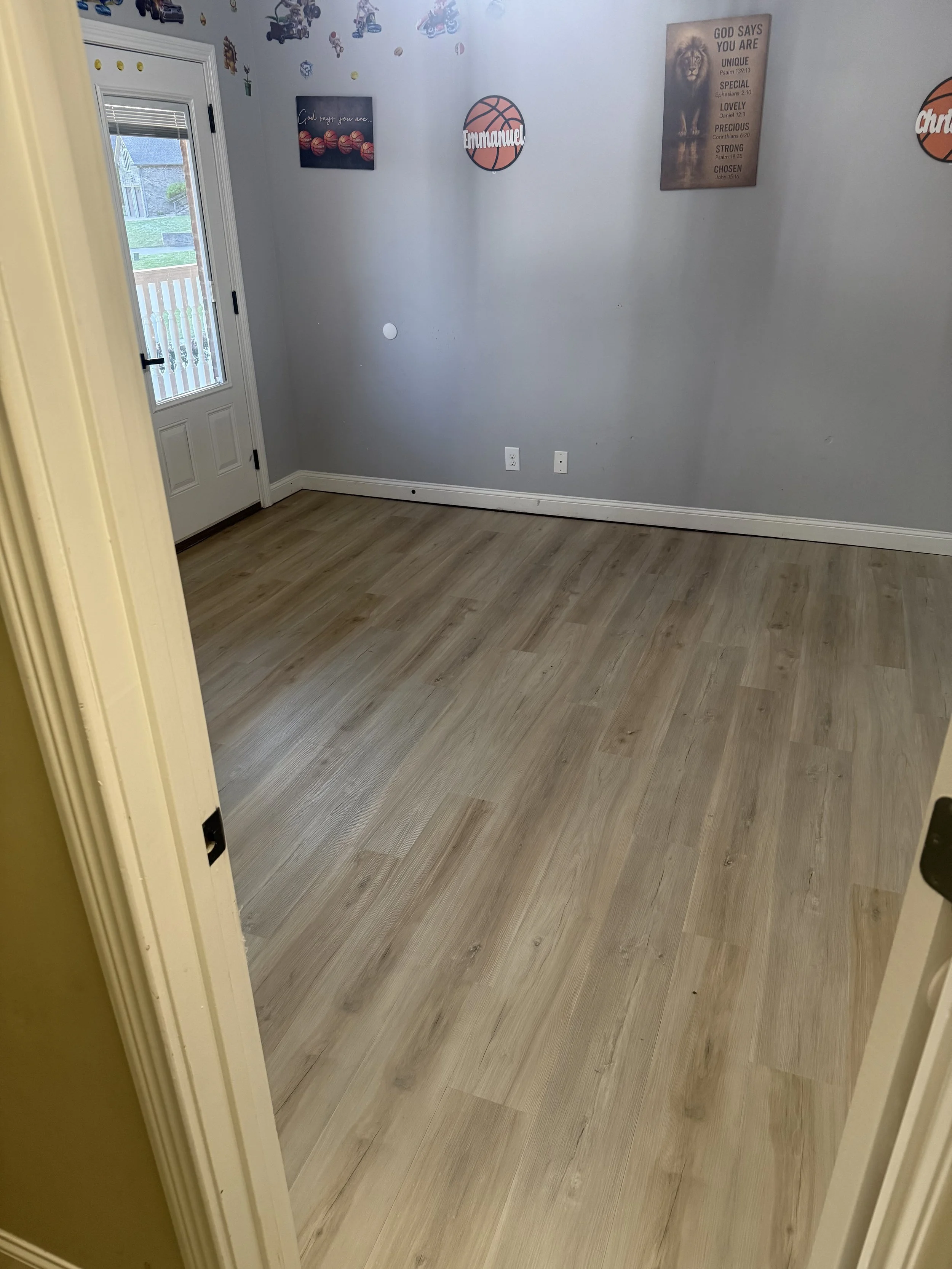 Completed luxury vinyl plank flooring installation in a bedroom for a rental property by All Phase Flooring LLC in Clarksville, Tennessee.