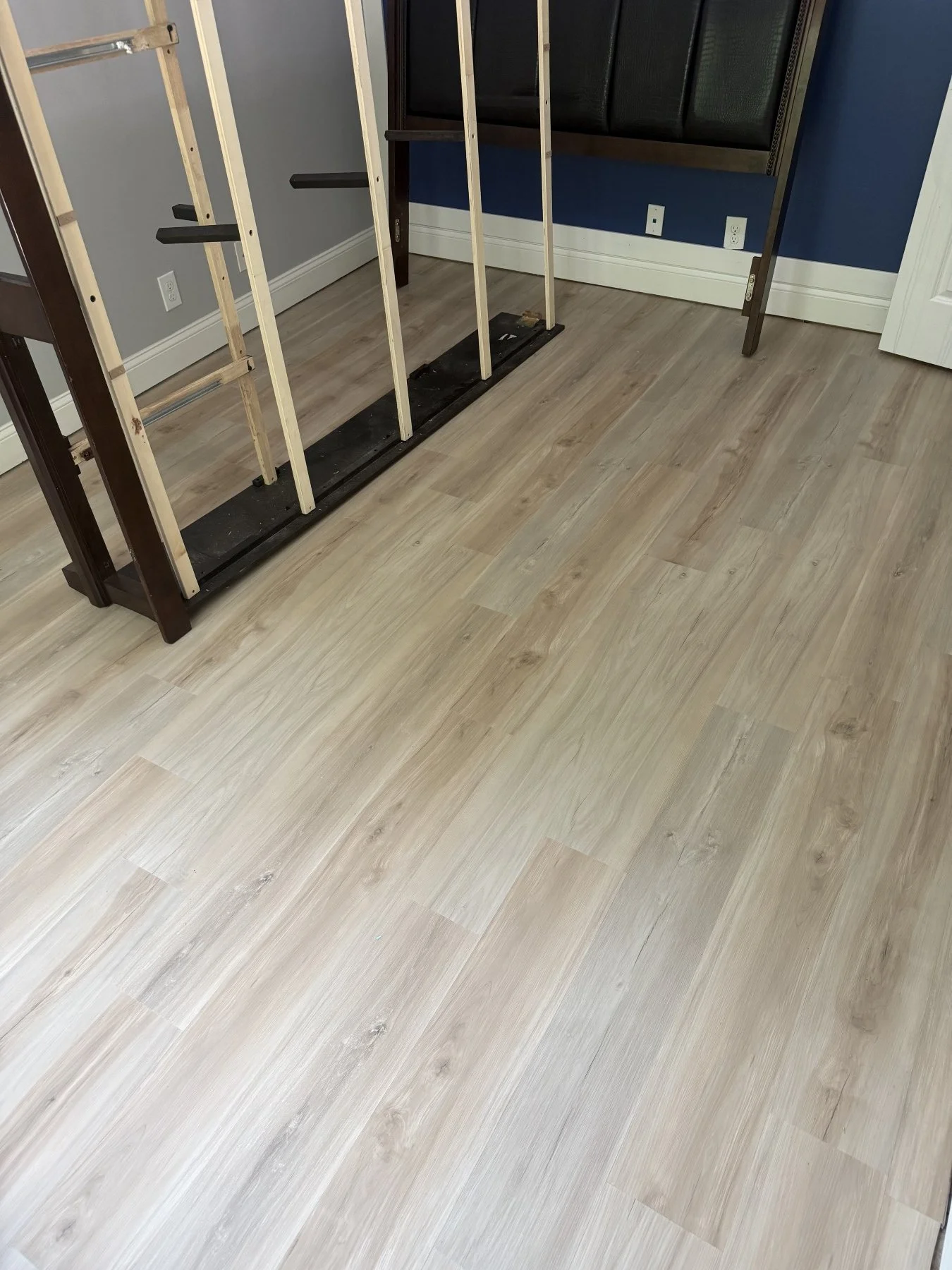 After photo showing a stunning new hard-surface flooring installation in a Montgomery County bedroom by All Phase Flooring LLC.