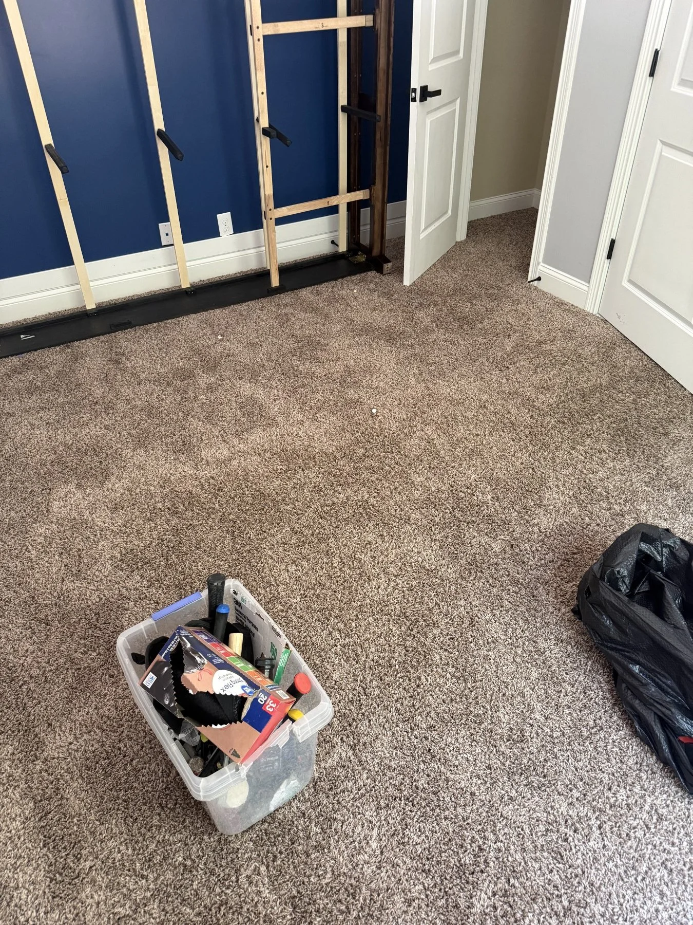 Before photo of a bedroom carpet tear-out and floor preparation by All Phase Flooring LLC in Montgomery County.