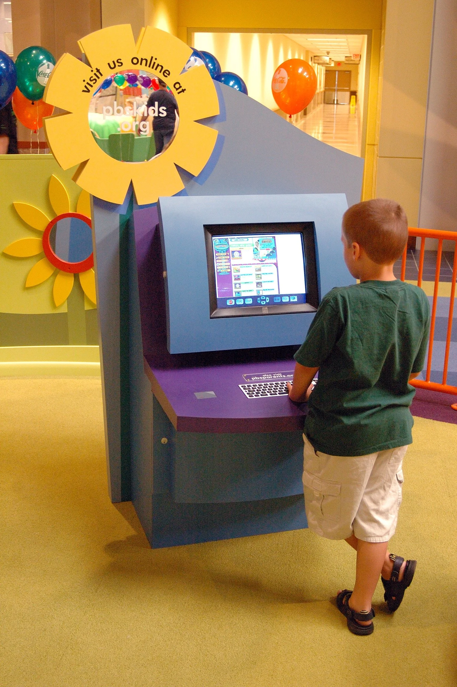 Children playing at PBS Kids Backyard play zone