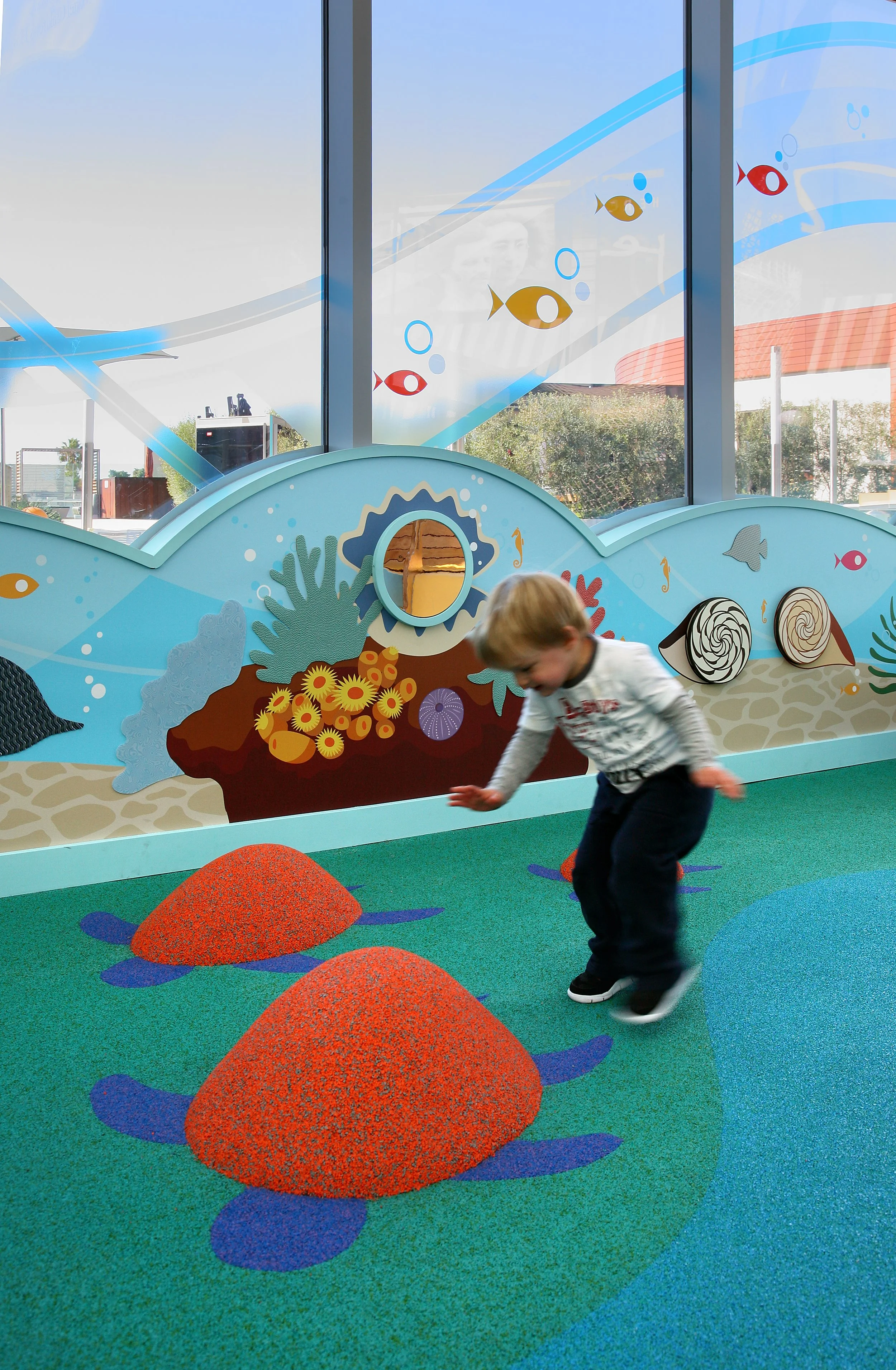 Children playing on the indoor playground at Samo Clubhouse