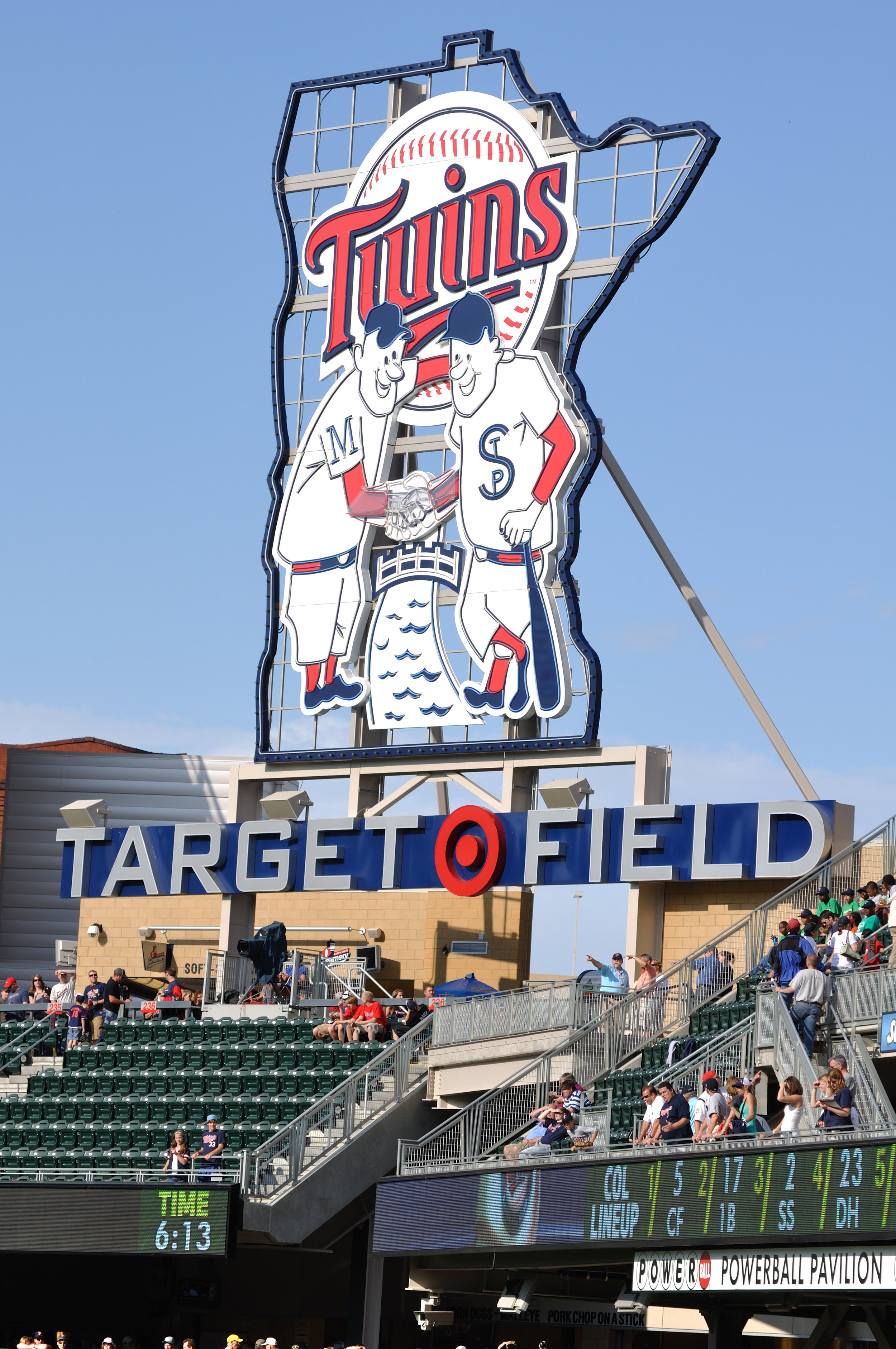 Sign for Target Field, home of the Minnesota Twins, with fans in the stands.