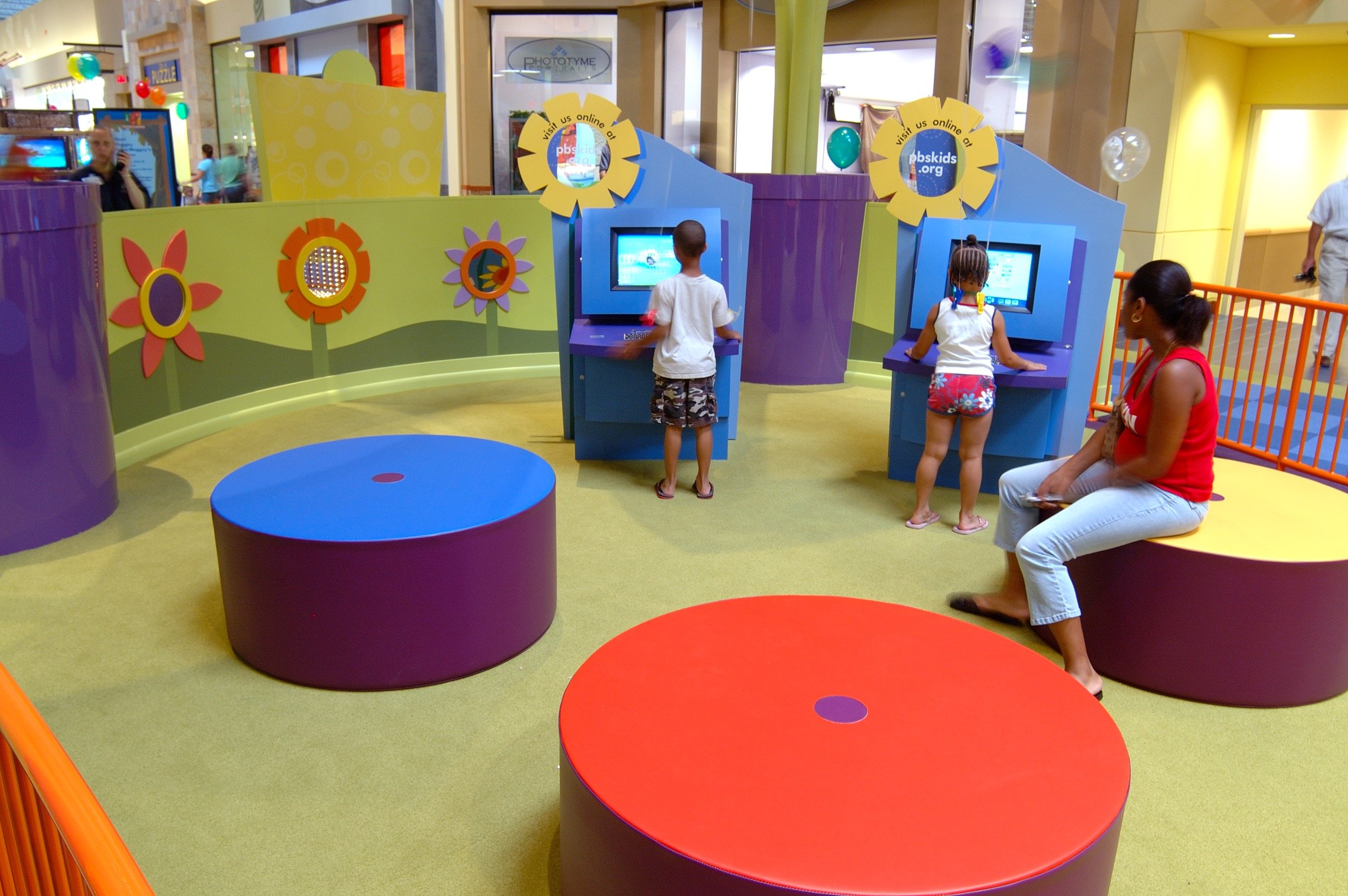 Children playing at PBS Kids Backyard play zone