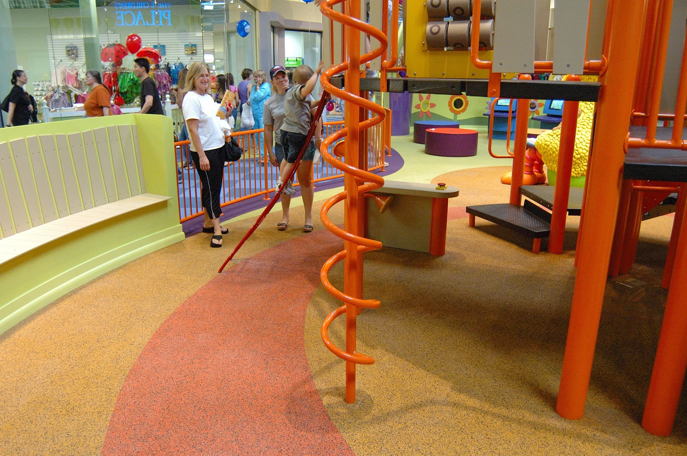 Children playing at PBS Kids Backyard play zone