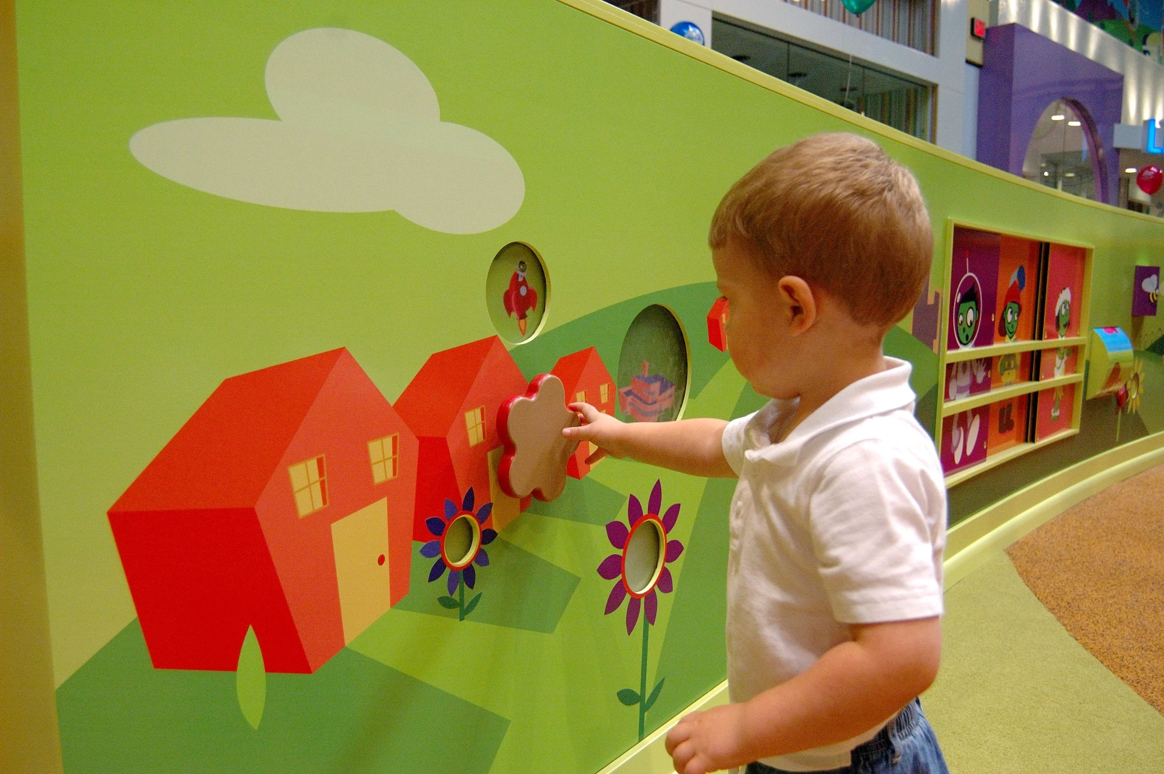 Children playing at PBS Kids Backyard play zone