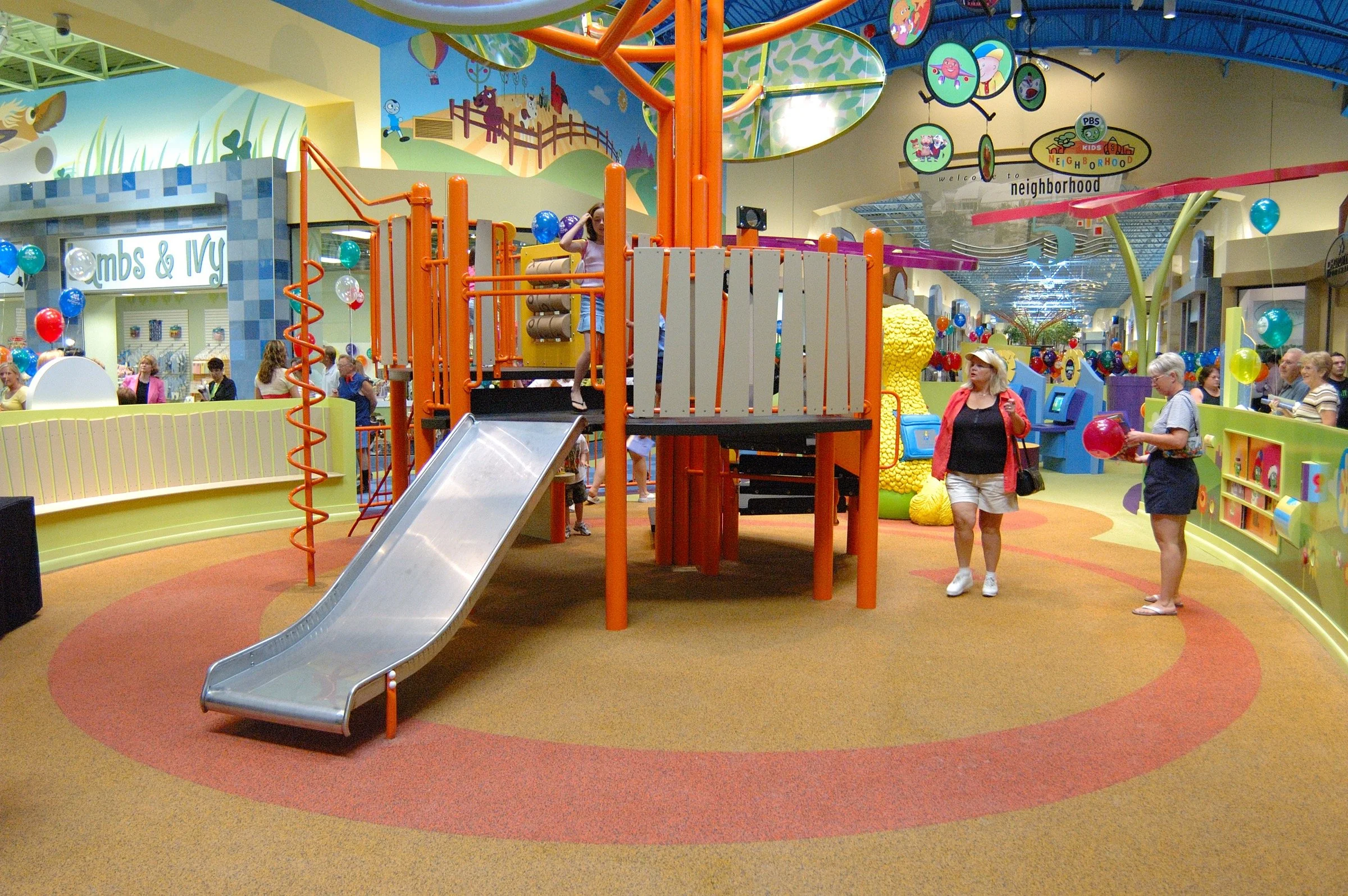 Children playing at PBS Kids Backyard play zone