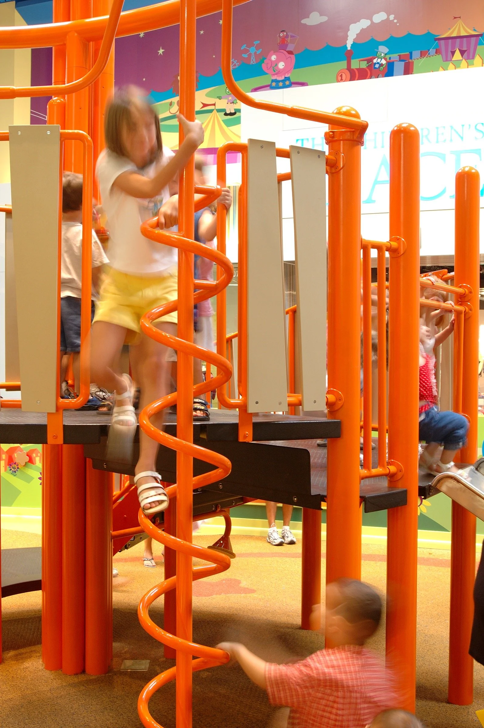 Children playing at PBS Kids Backyard play zone