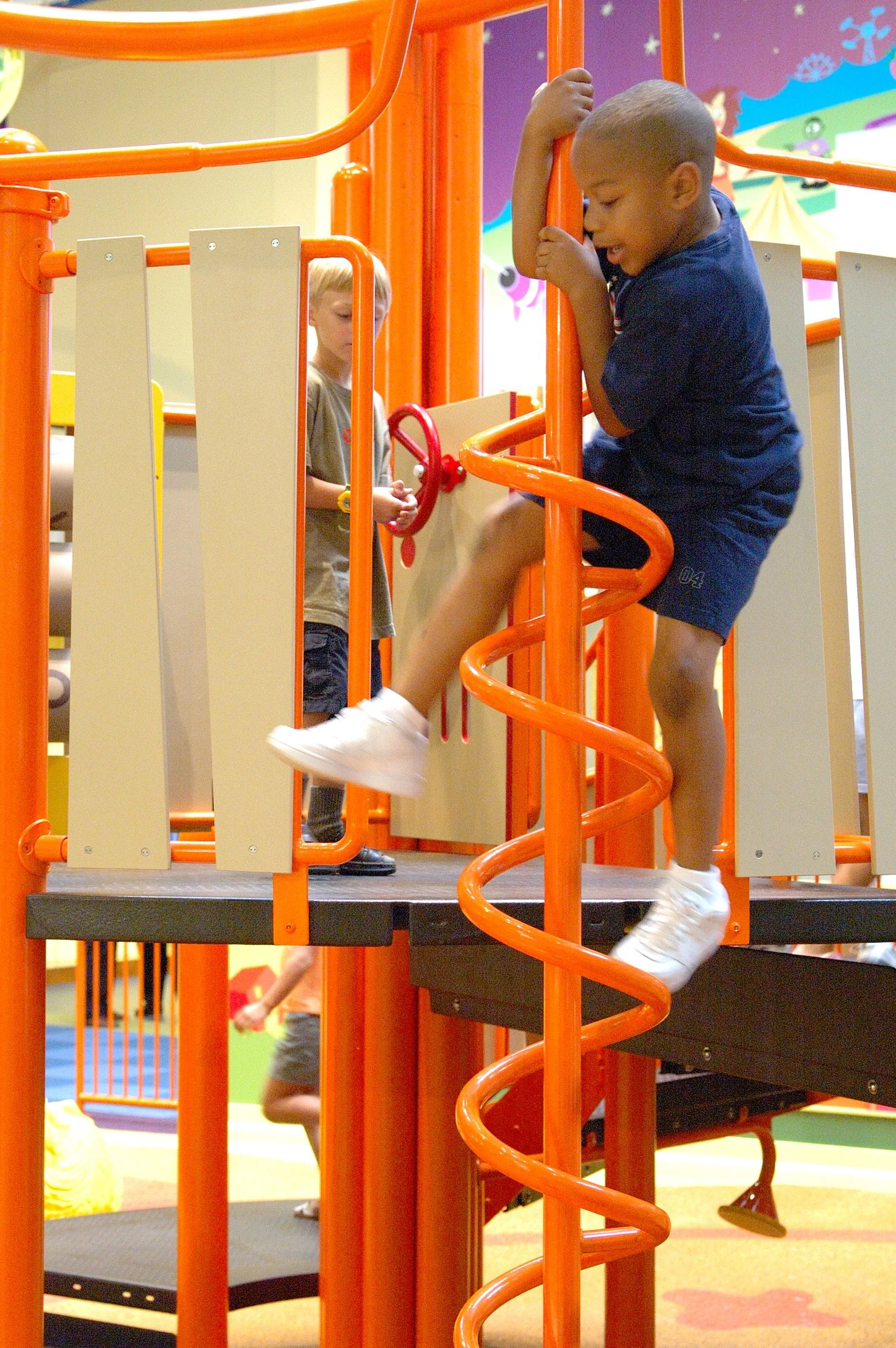 Children playing at PBS Kids Backyard play zone