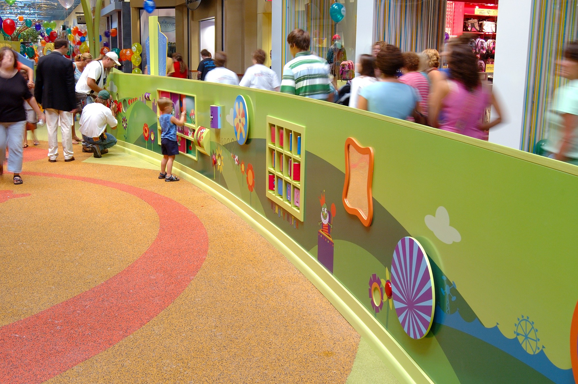 Children playing at PBS Kids Backyard play zone