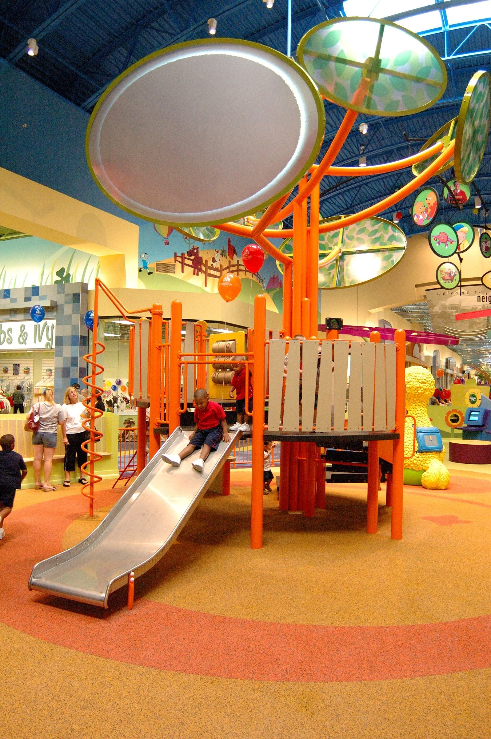 Children playing at PBS Kids Backyard play zone
