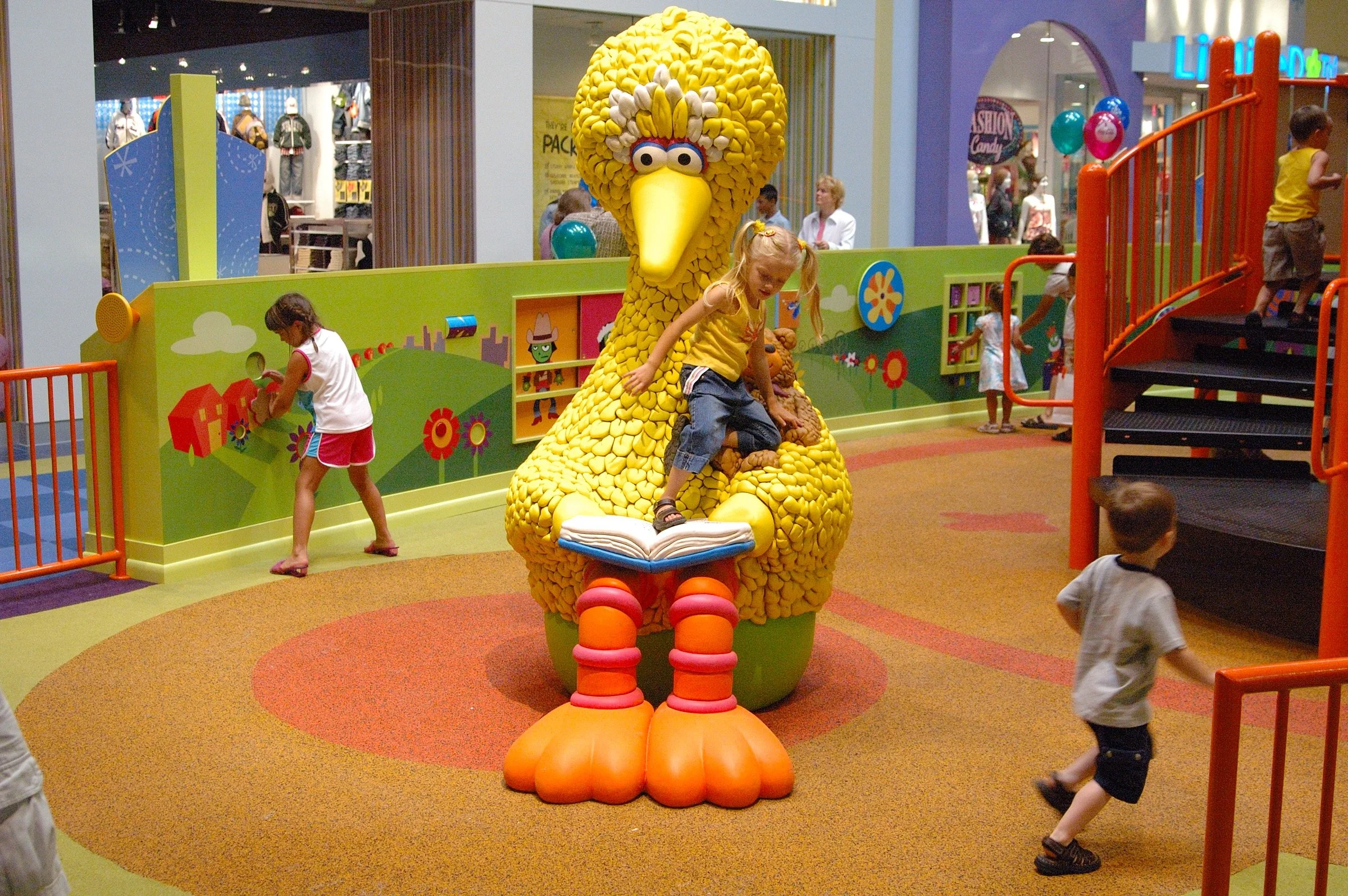 Children playing at PBS Kids Backyard play zone