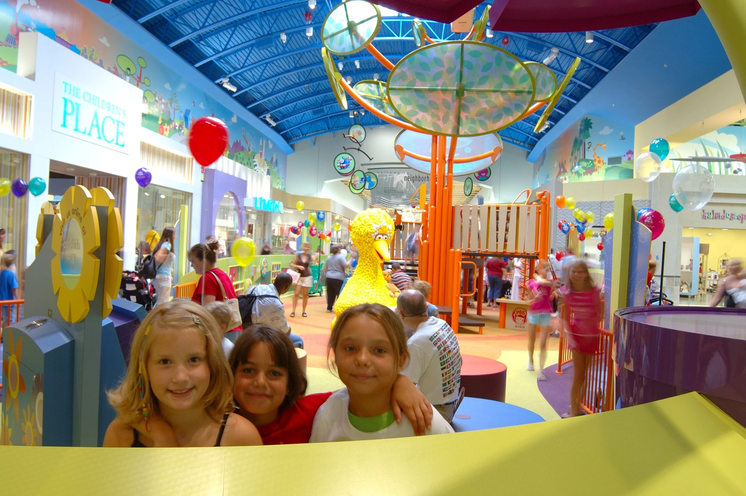 Children playing at PBS Kids Backyard play zone