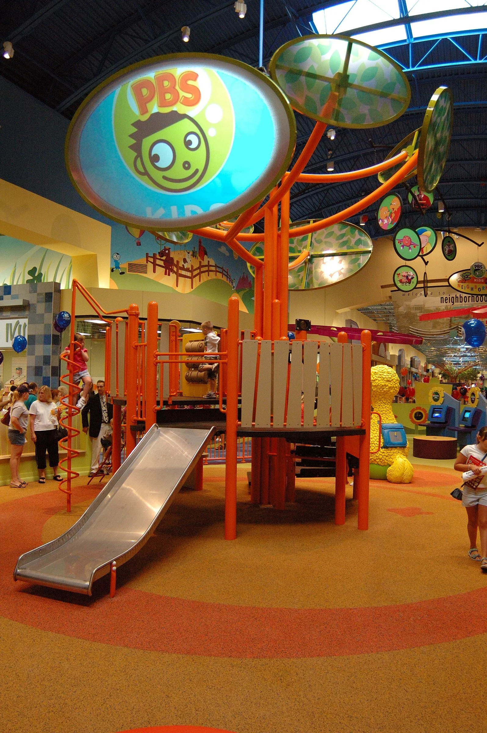 Children playing at PBS Kids Backyard play zone
