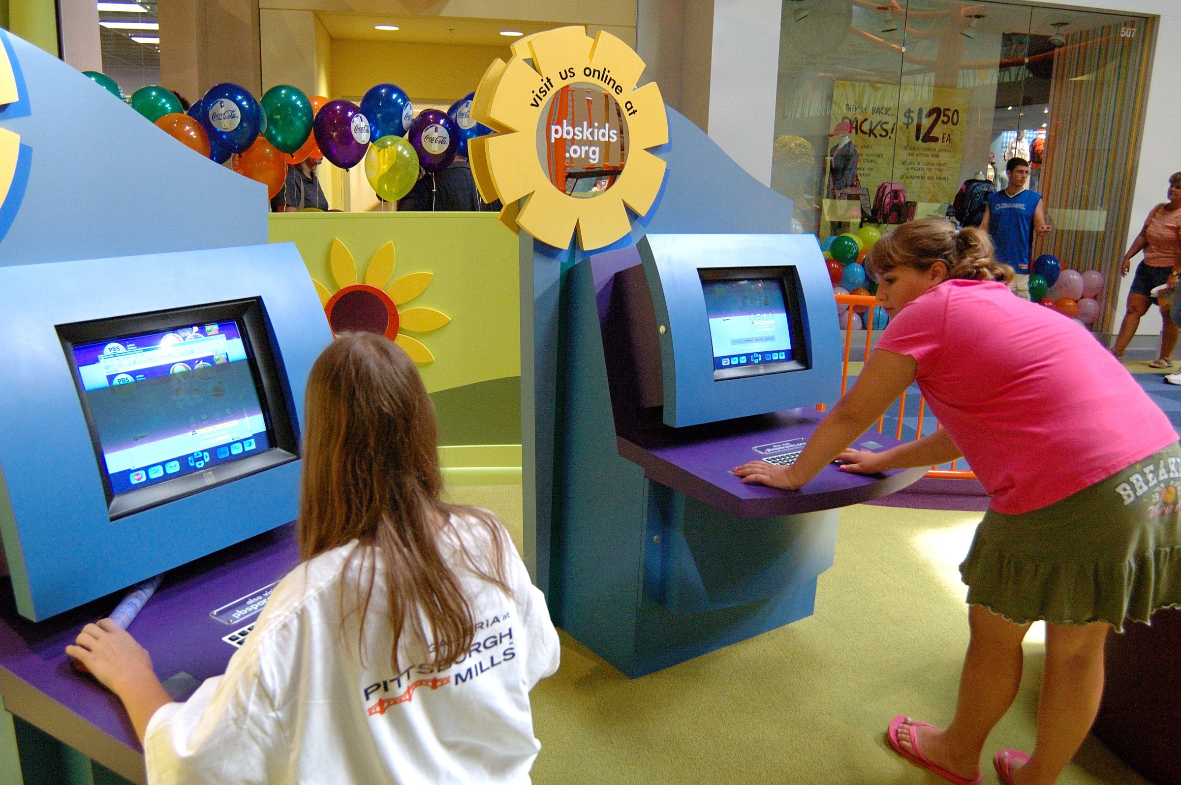 Children playing at PBS Kids Backyard play zone
