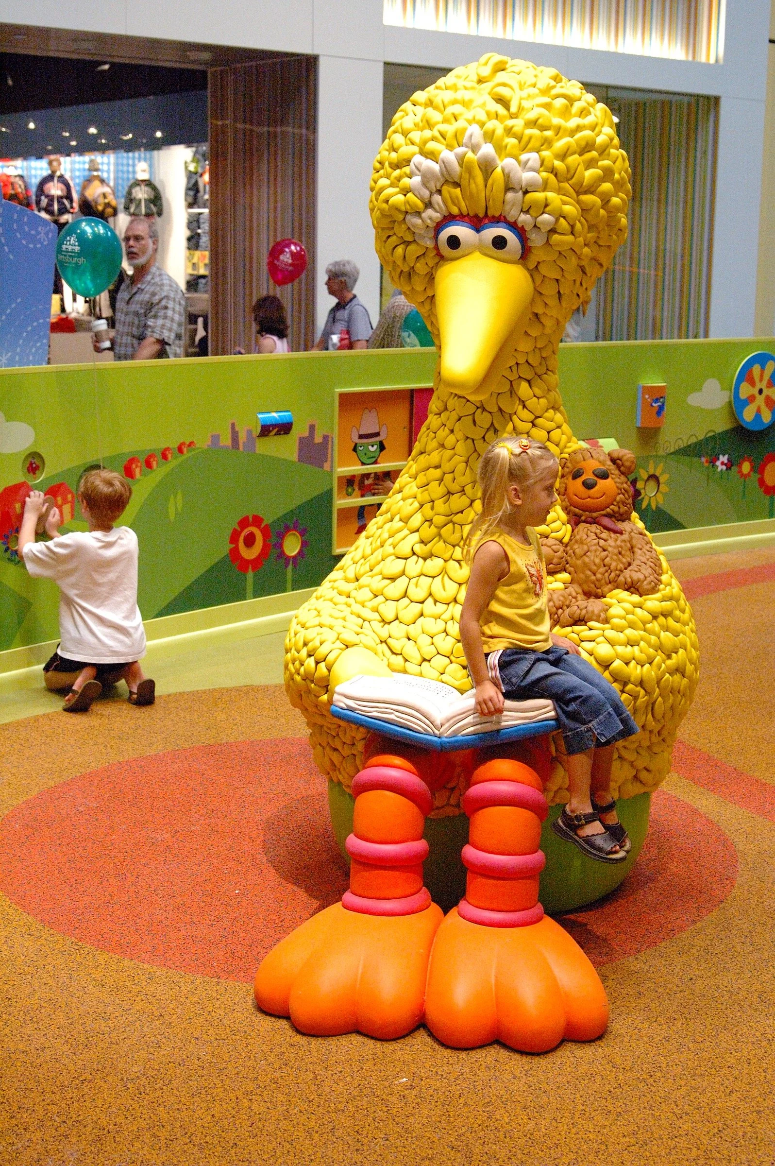 Children playing at PBS Kids Backyard play zone