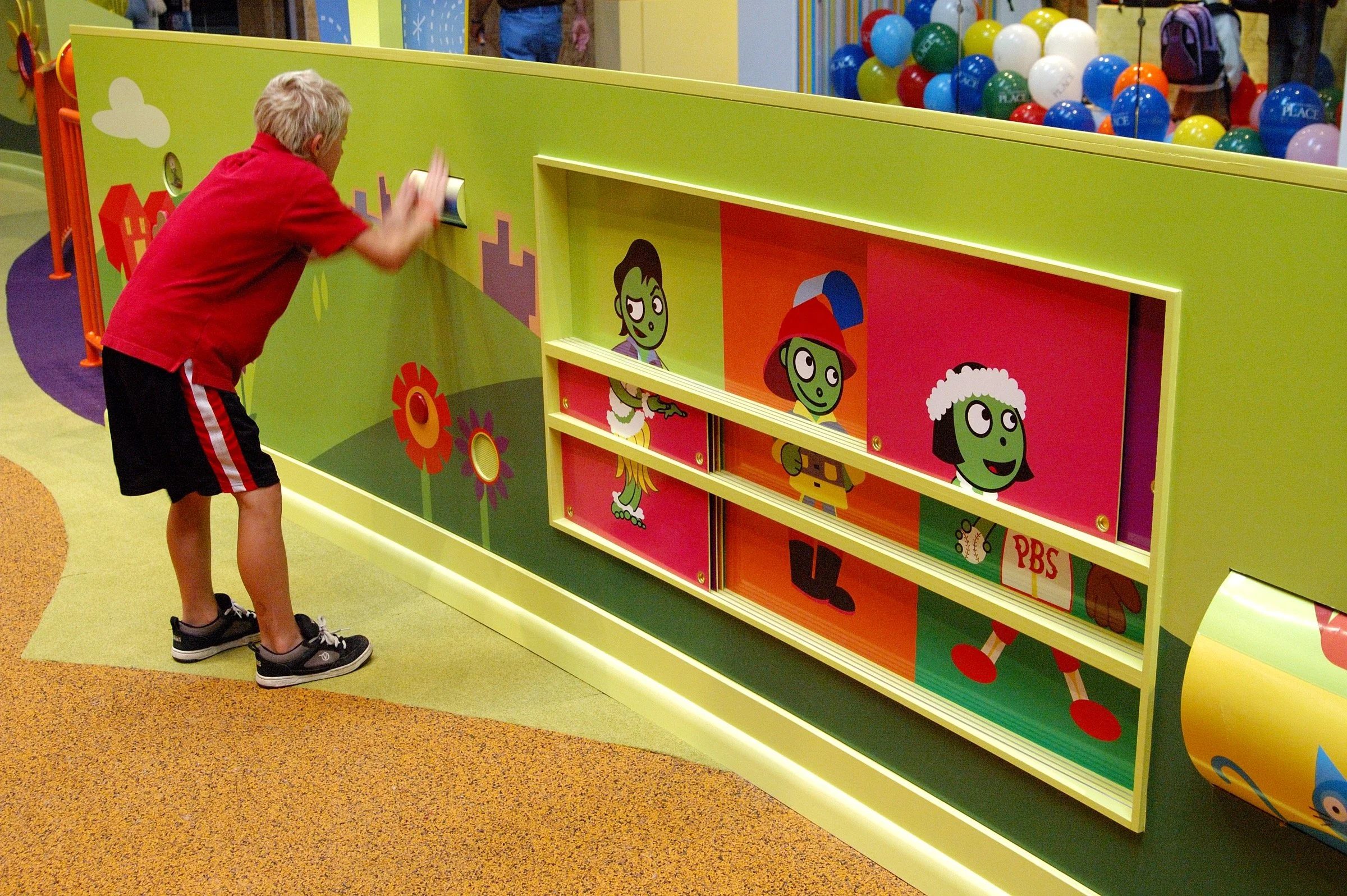 Children playing at PBS Kids Backyard play zone
