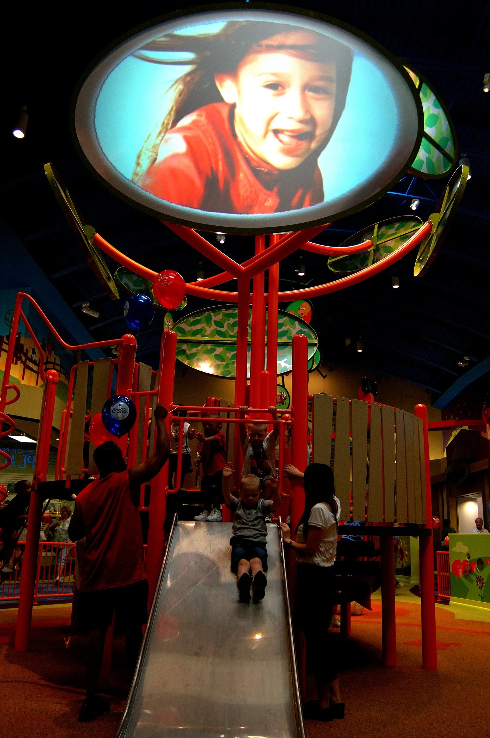 Children playing at PBS Kids Backyard play zone