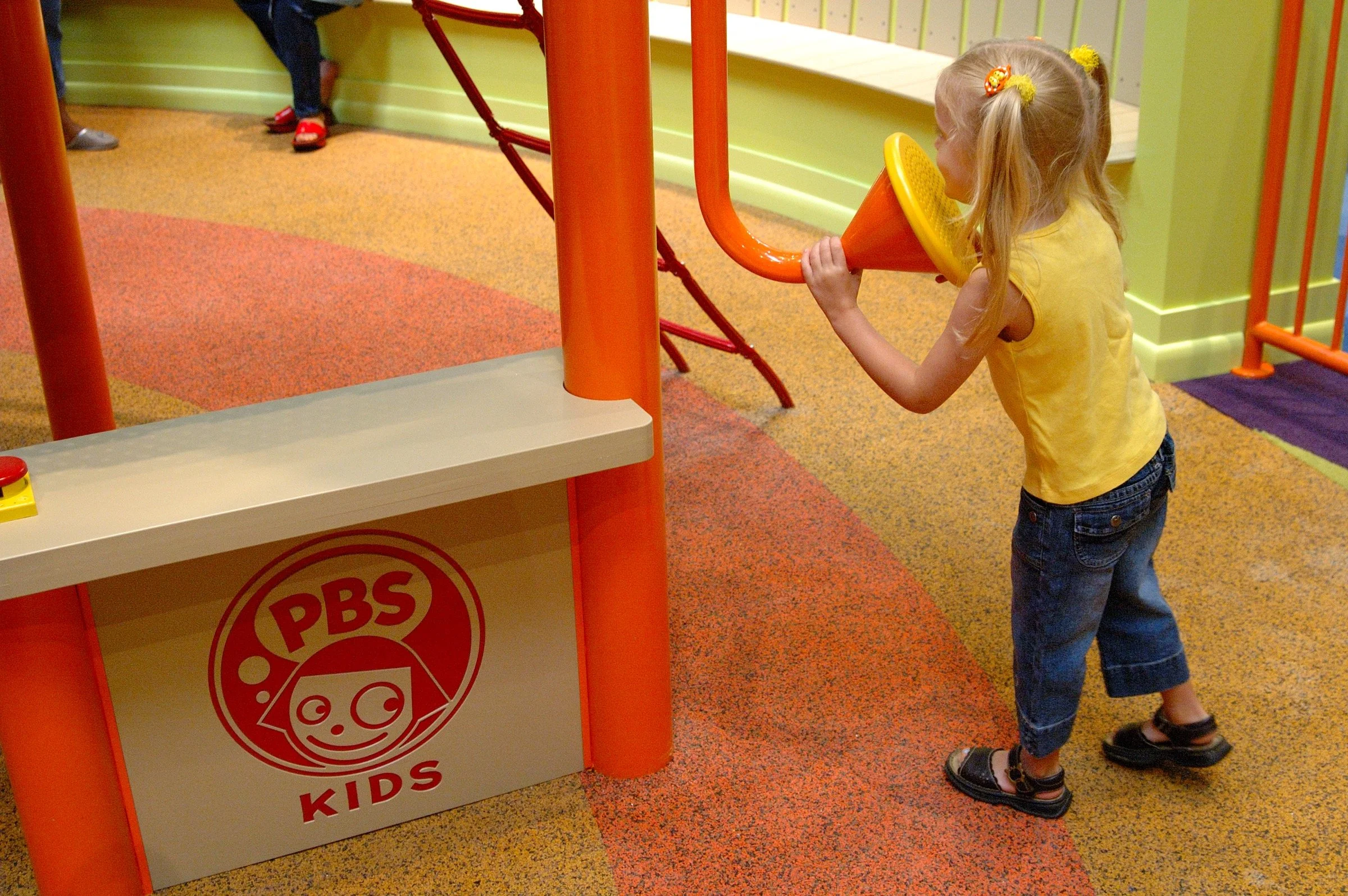 Children playing at PBS Kids Backyard play zone