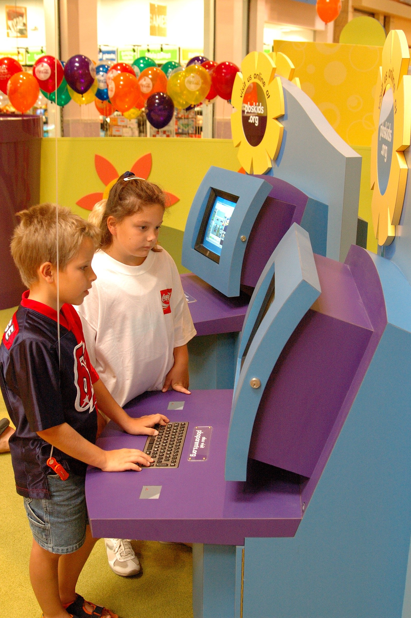 Children playing at PBS Kids Backyard play zone