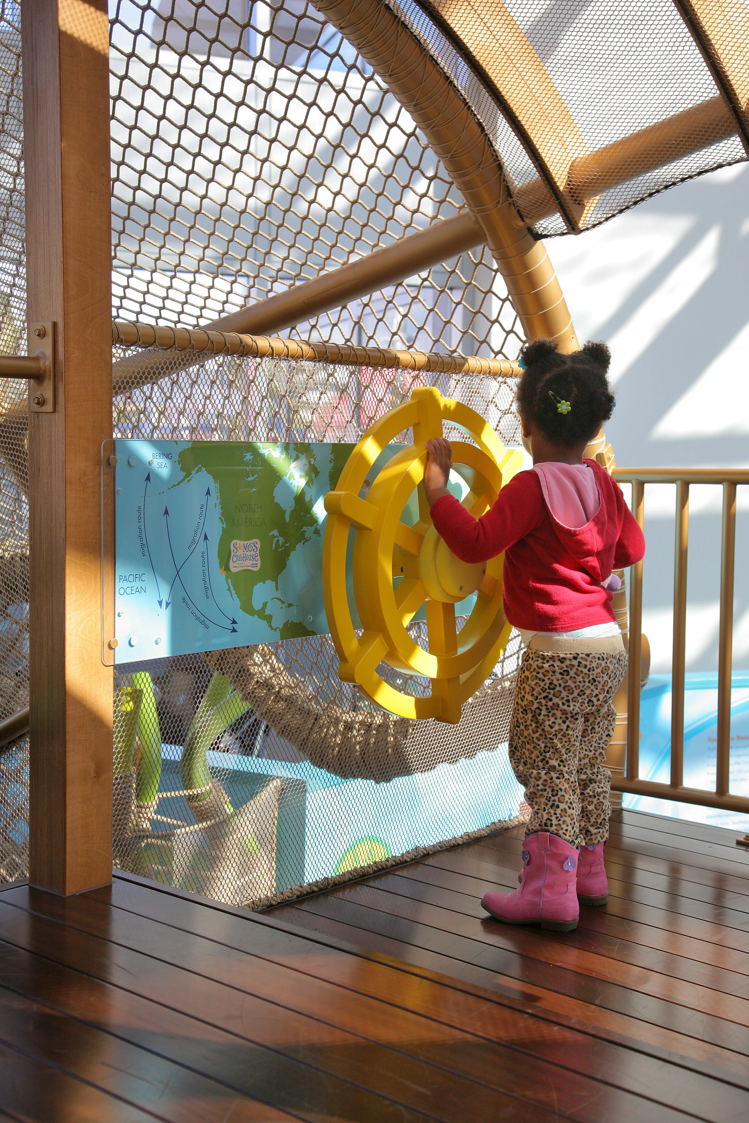 Children playing on the indoor playground at Samo Clubhouse