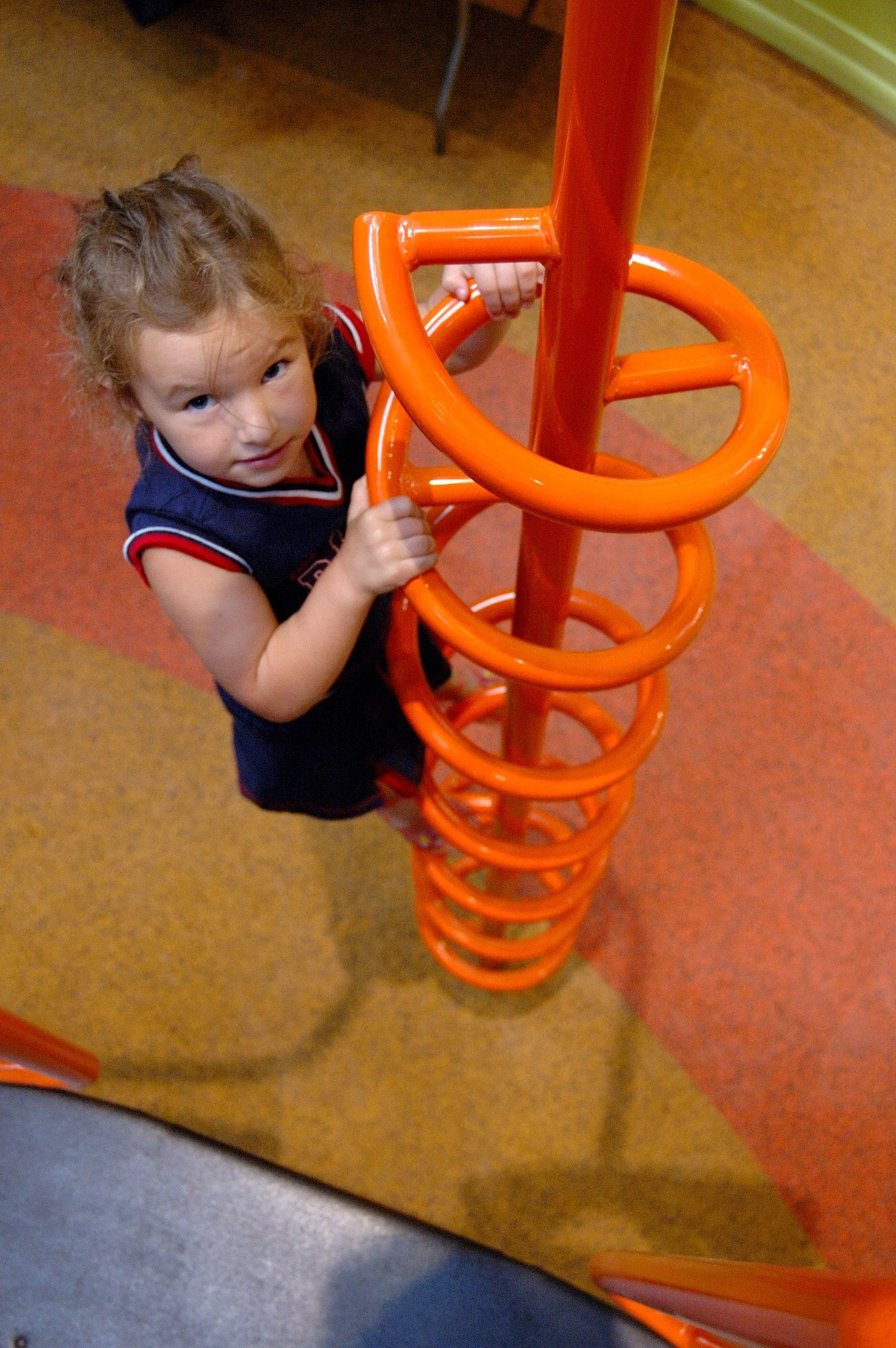 Children playing in the PBS Kids Backyard play zone.
