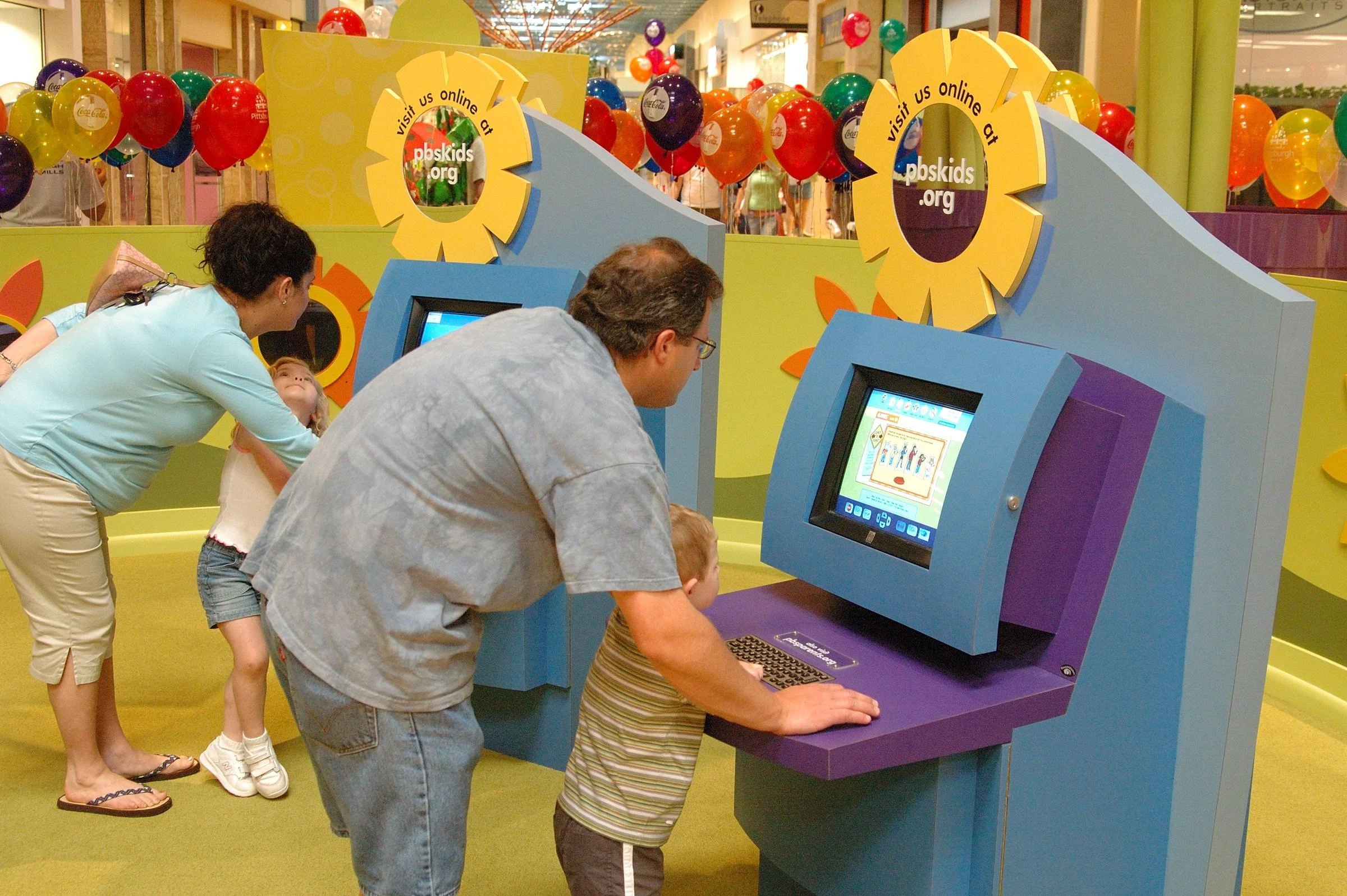 Children playing at PBS Kids Backyard play zone