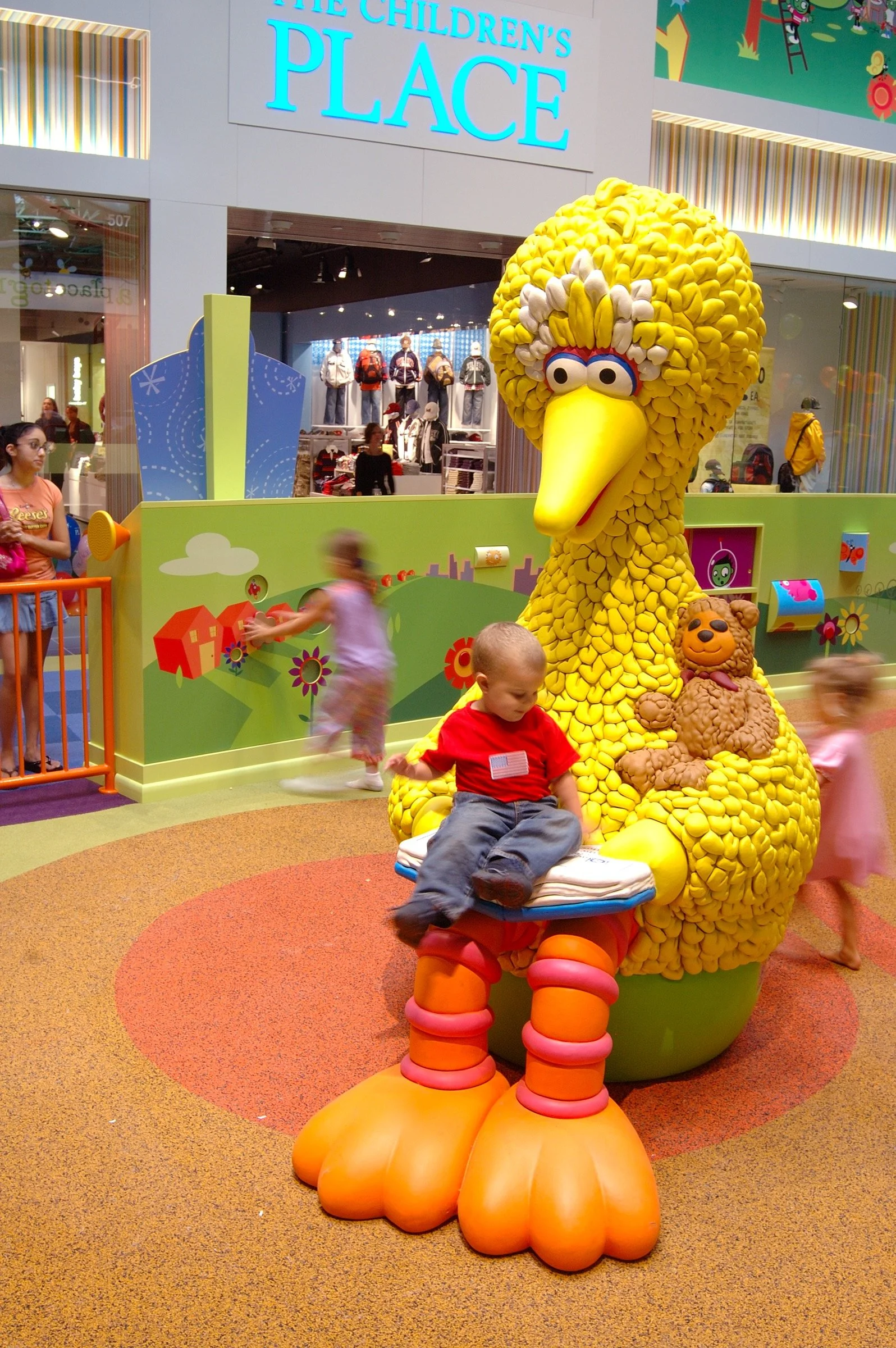 Children playing at PBS Kids Backyard play zone