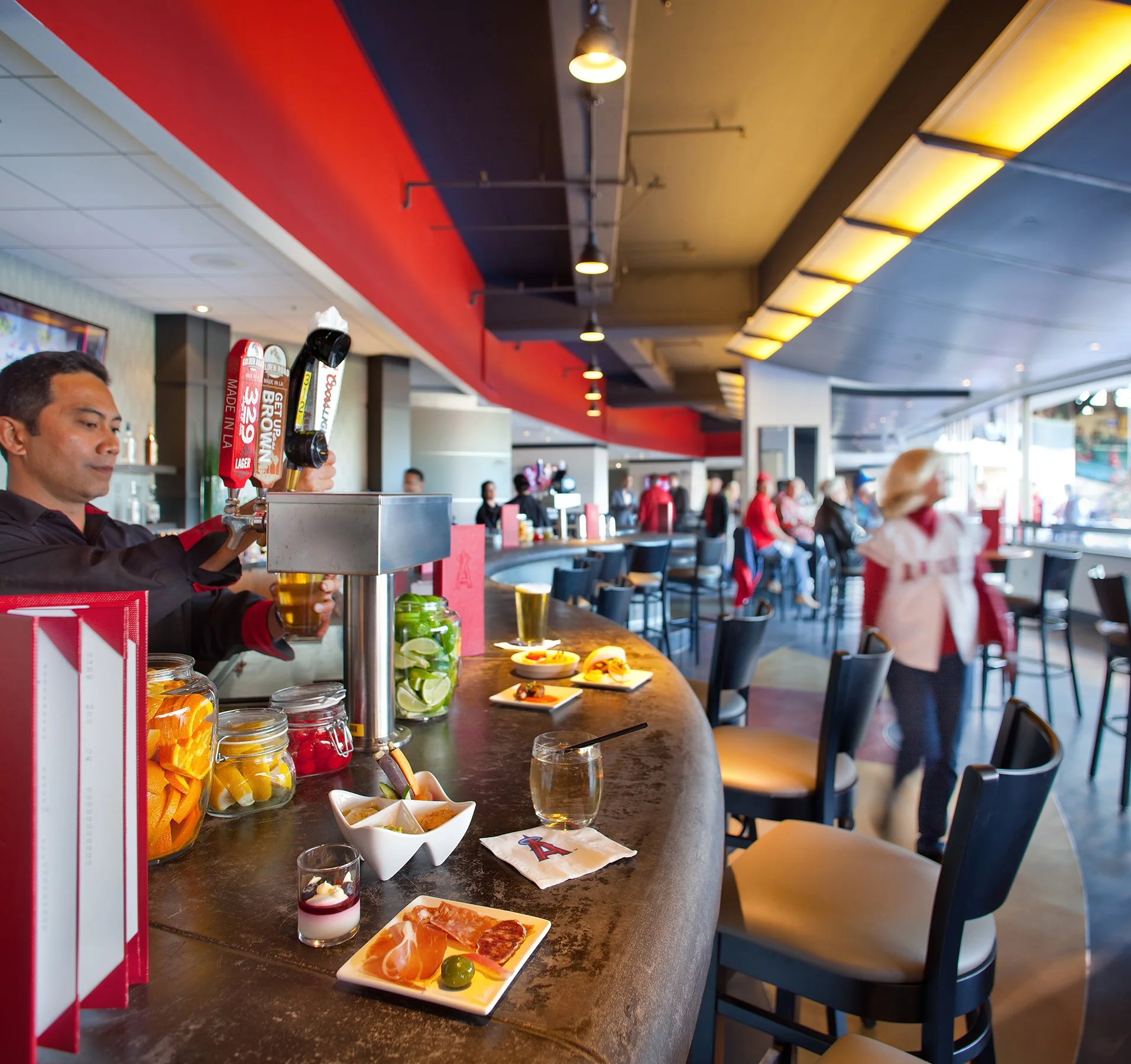 Halo at Angel Stadium restaurant interior with a counter serving drinks and food. 