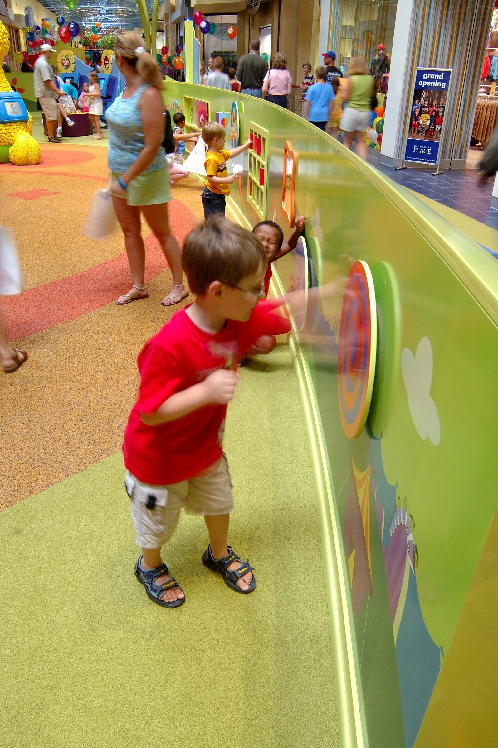 Children playing at PBS Kids Backyard play zone