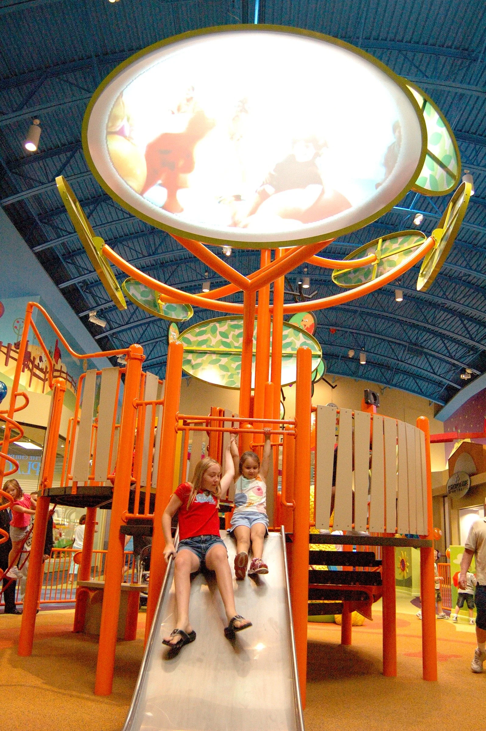 Children playing at PBS Kids Backyard play zone