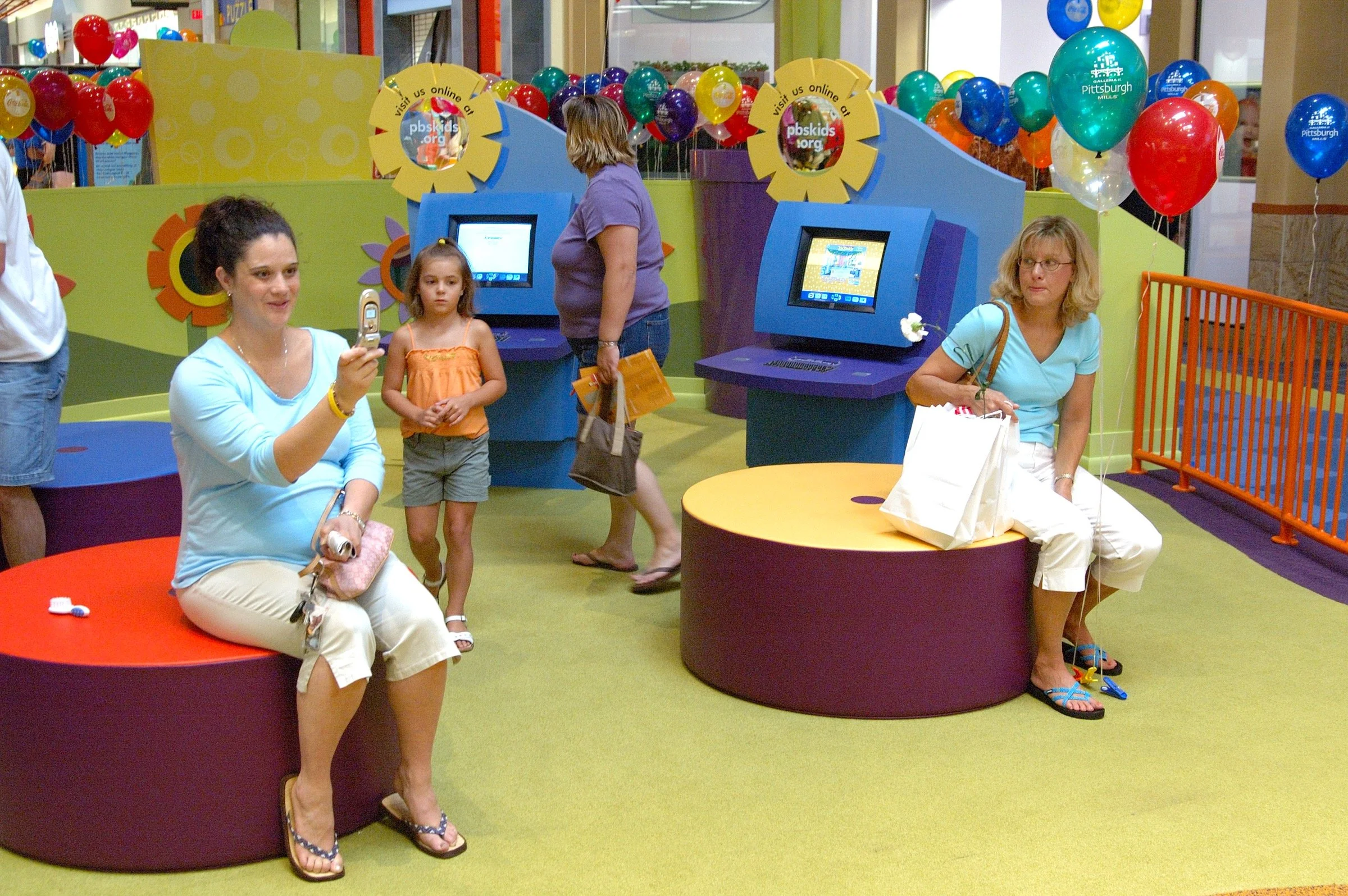 Children playing at PBS Kids Backyard play zone