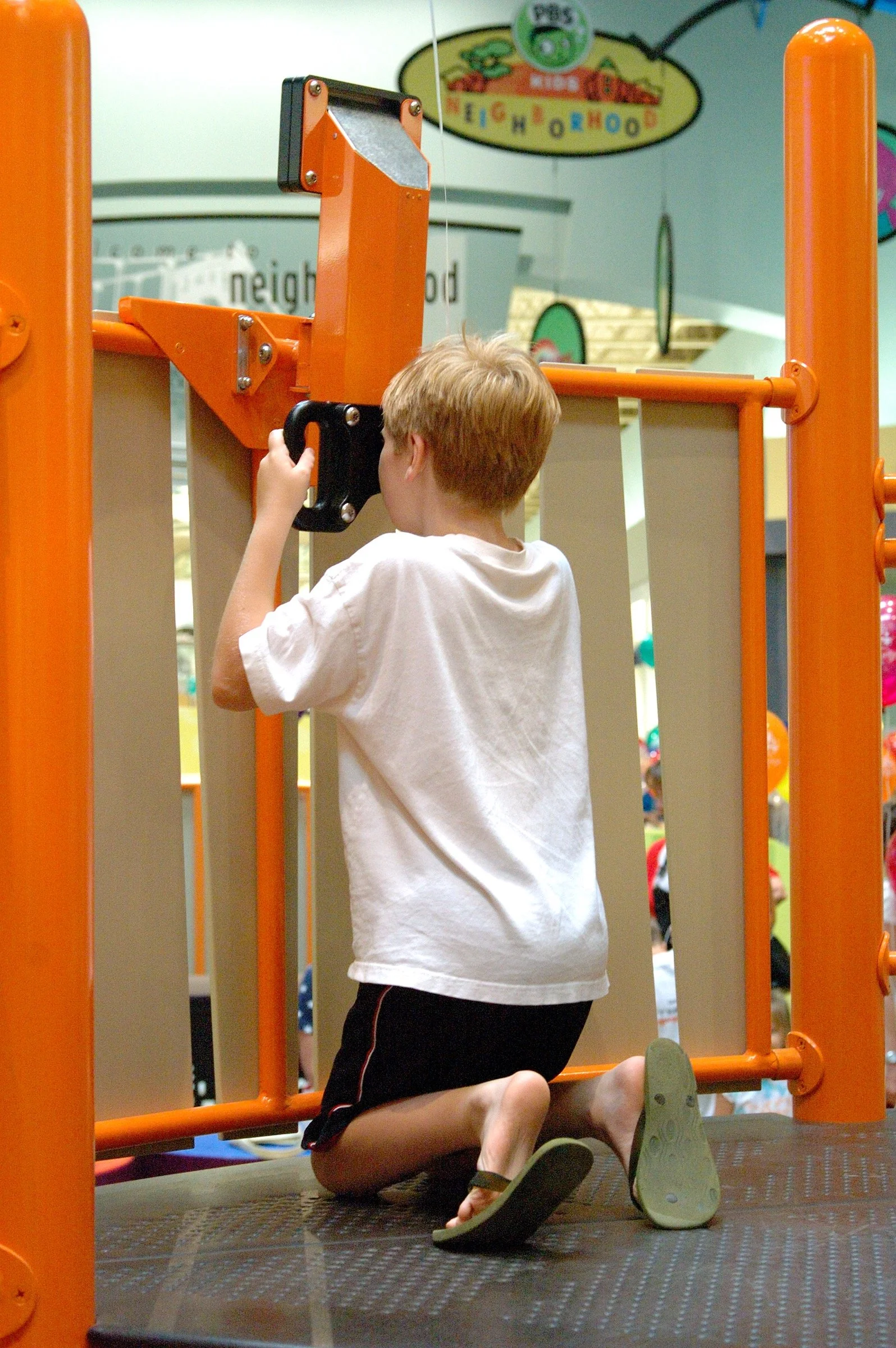Children playing at PBS Kids Backyard play zone