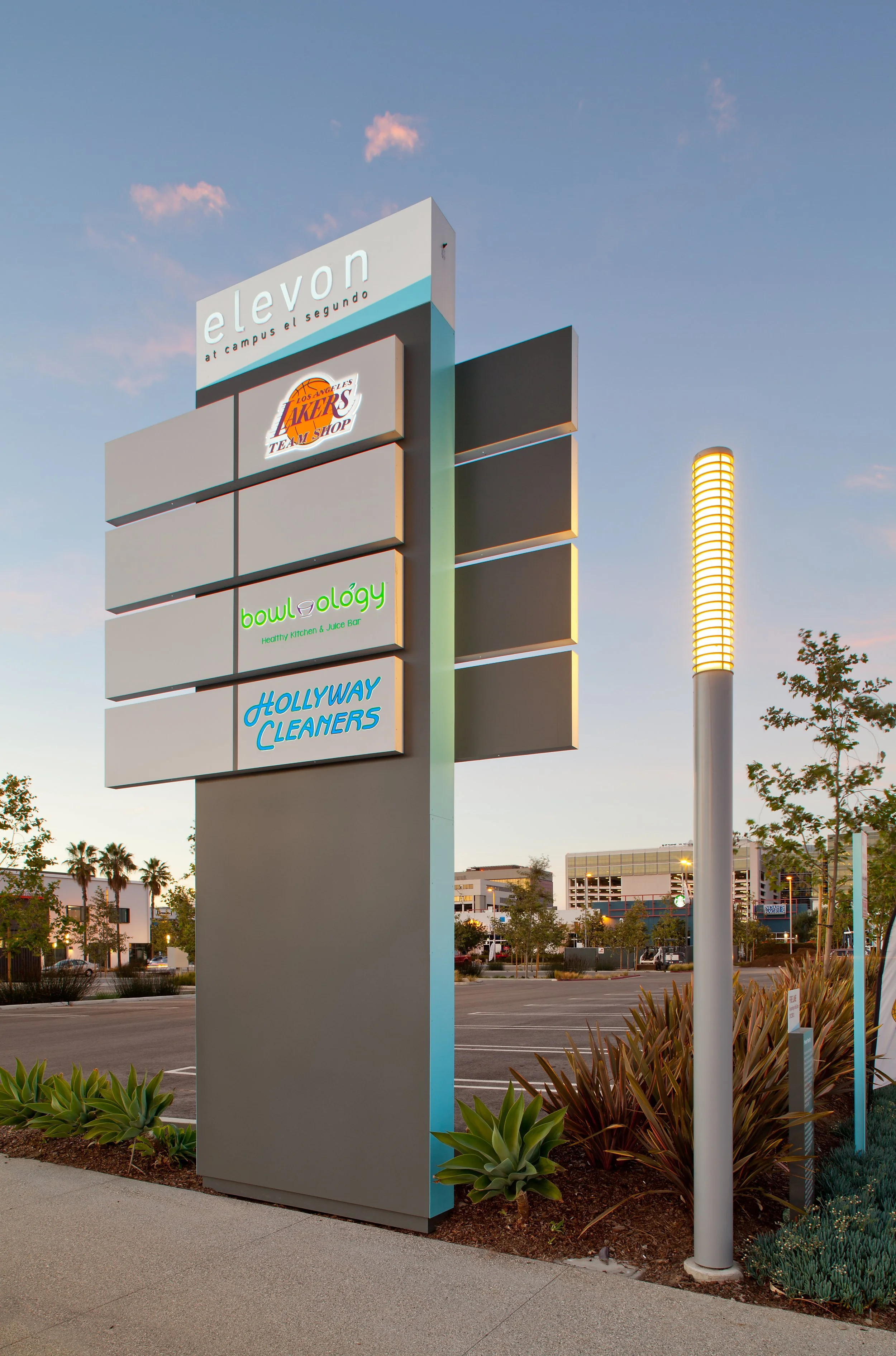 A large outdoor sign featuring the word 'eleven' at the top