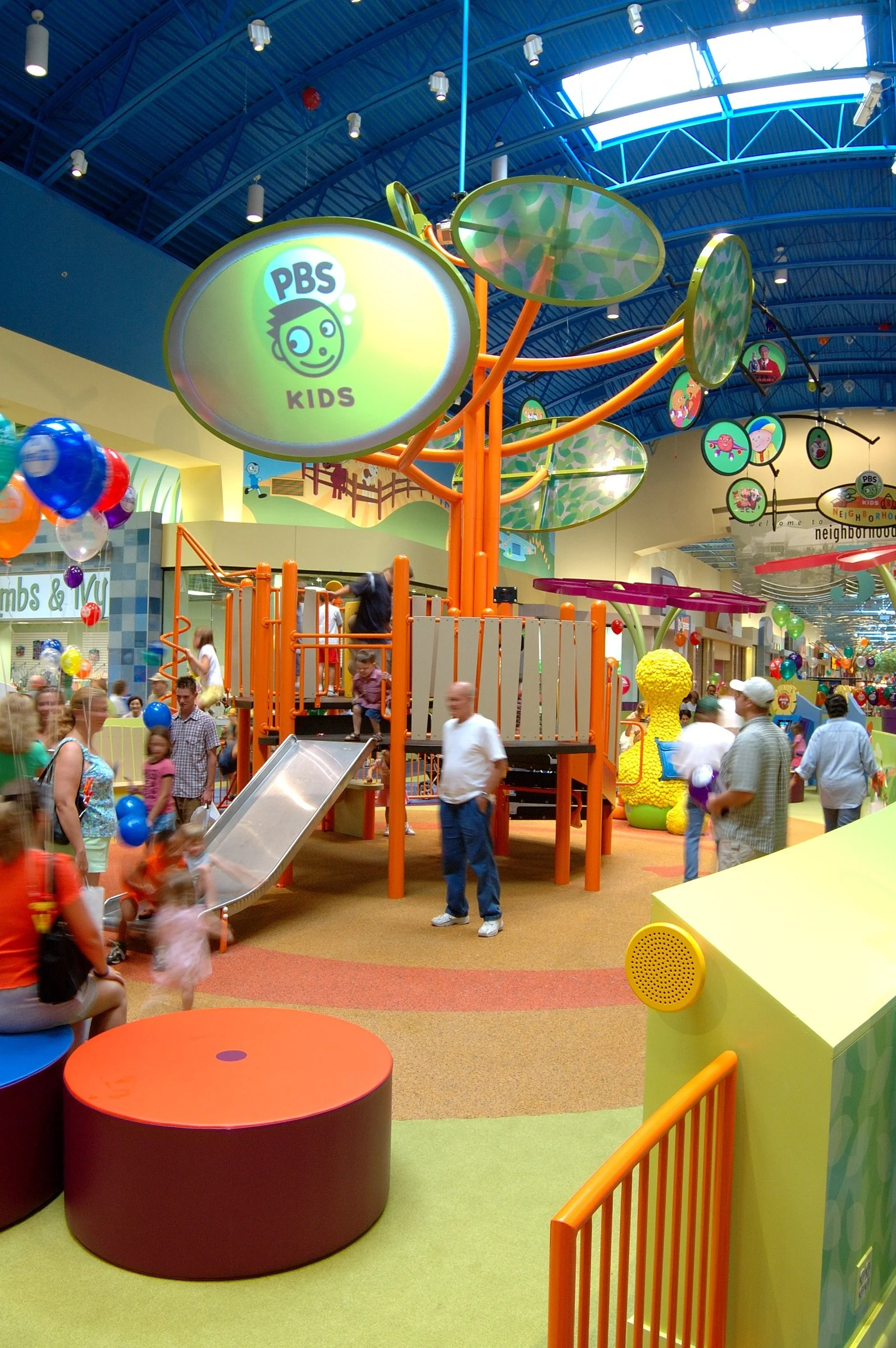 Children playing at PBS Kids Backyard play zone
