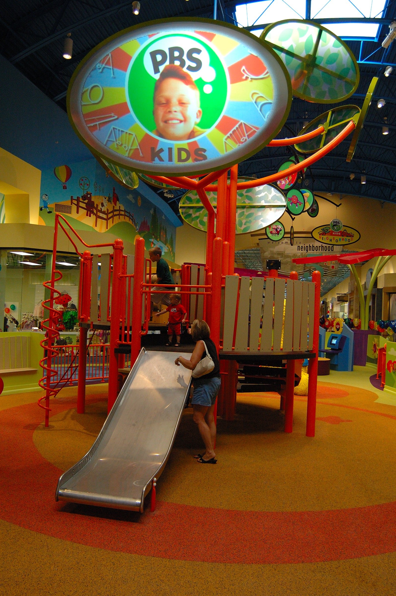 Children playing at PBS Kids Backyard play zone