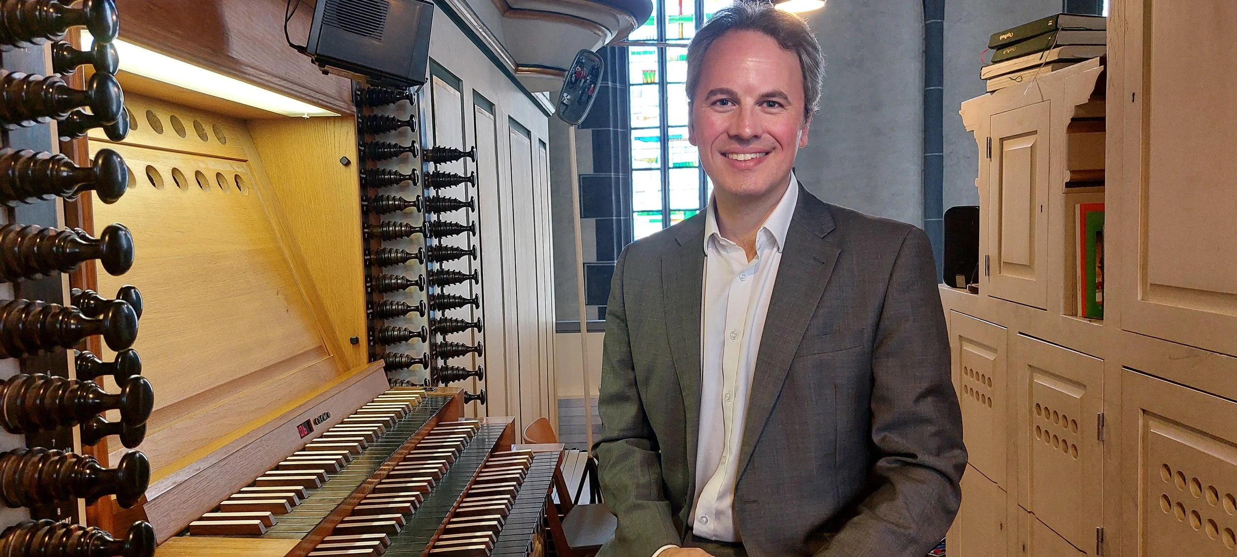 Photo of David Pipe sat at an organ