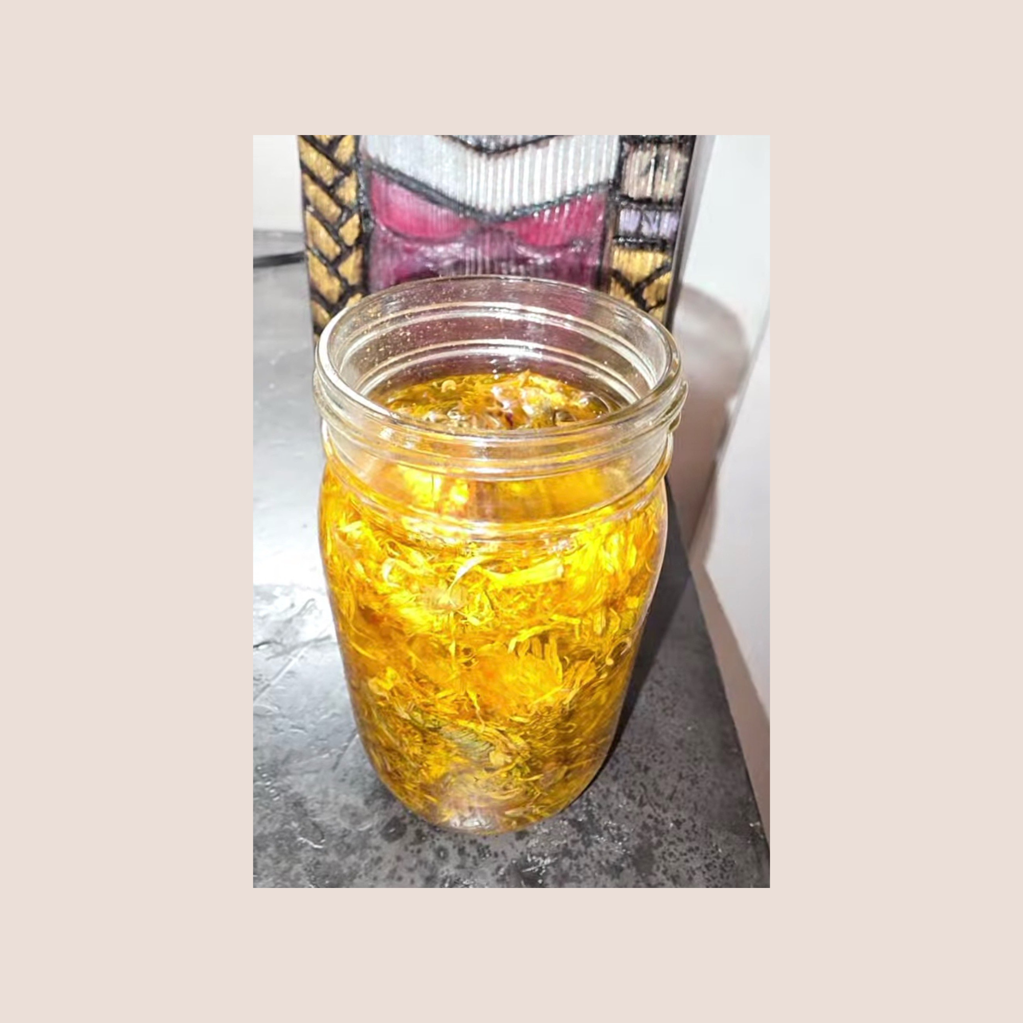 close up of calendula infused jojoba oil