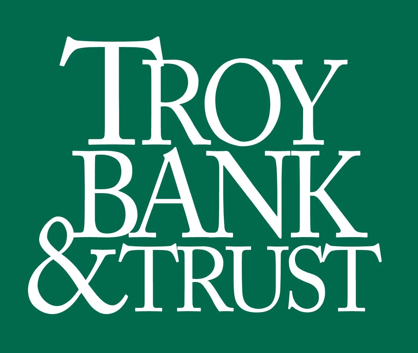 Logo of Troy Bank & Trust with white text on a dark green background.