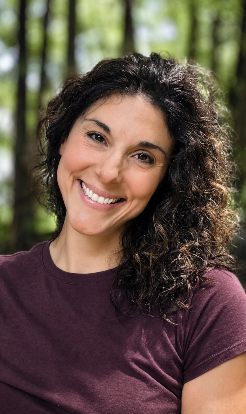 An outdoor photograph of Ashley Galletta, M.S., CCC-SLP, owner and pediatric speech & feeding therapist at Nourish Feeding and Speech Therapy in Athens, GA