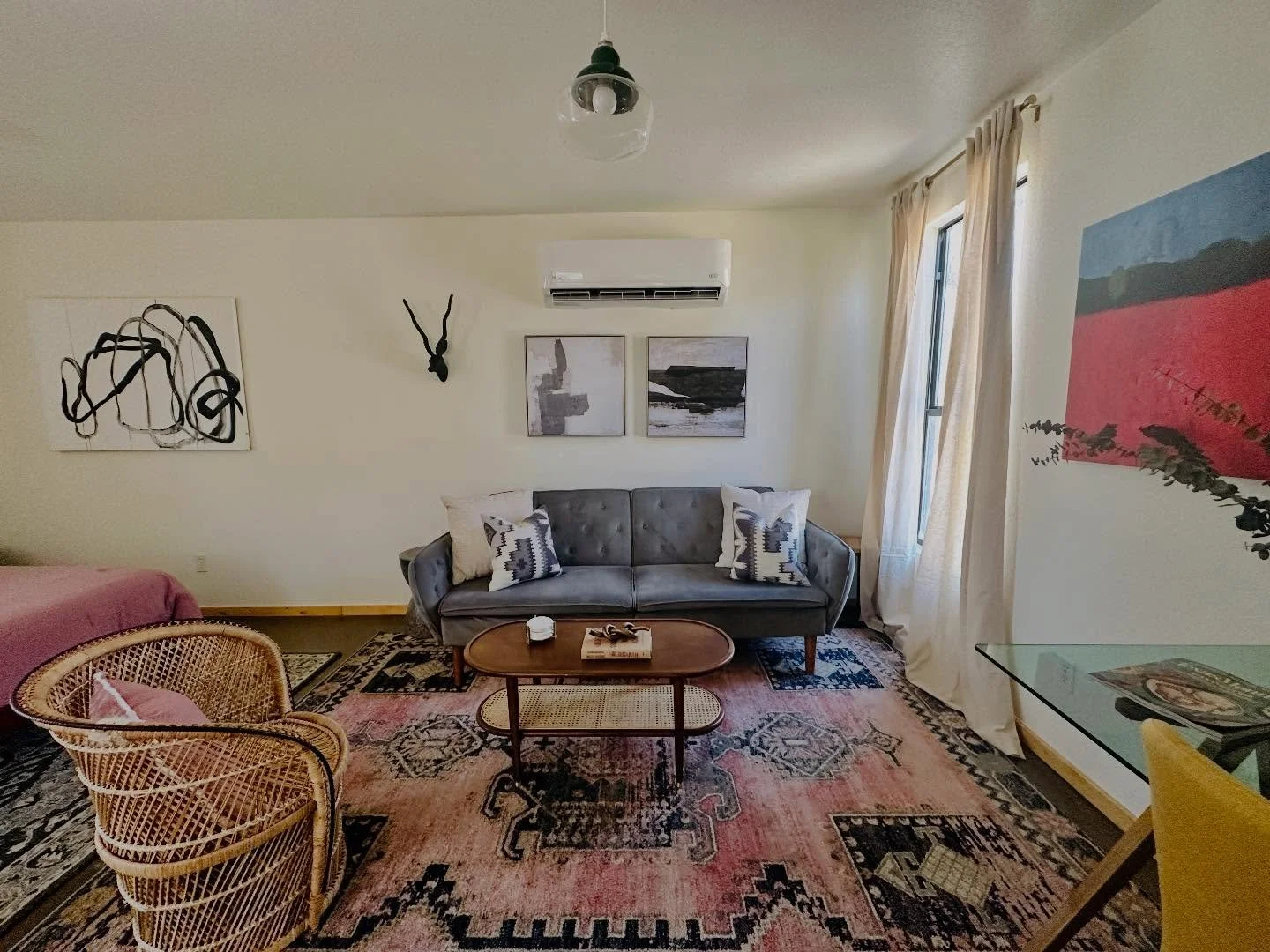 Rounding out the sweet hill country bungalow is the bedroom and living area as well as the built in dining table. A neighbor down the road provided the gorgeous wood for the above dining shelves from local fallen trees. Visit @mosaicsmtx to book a ni